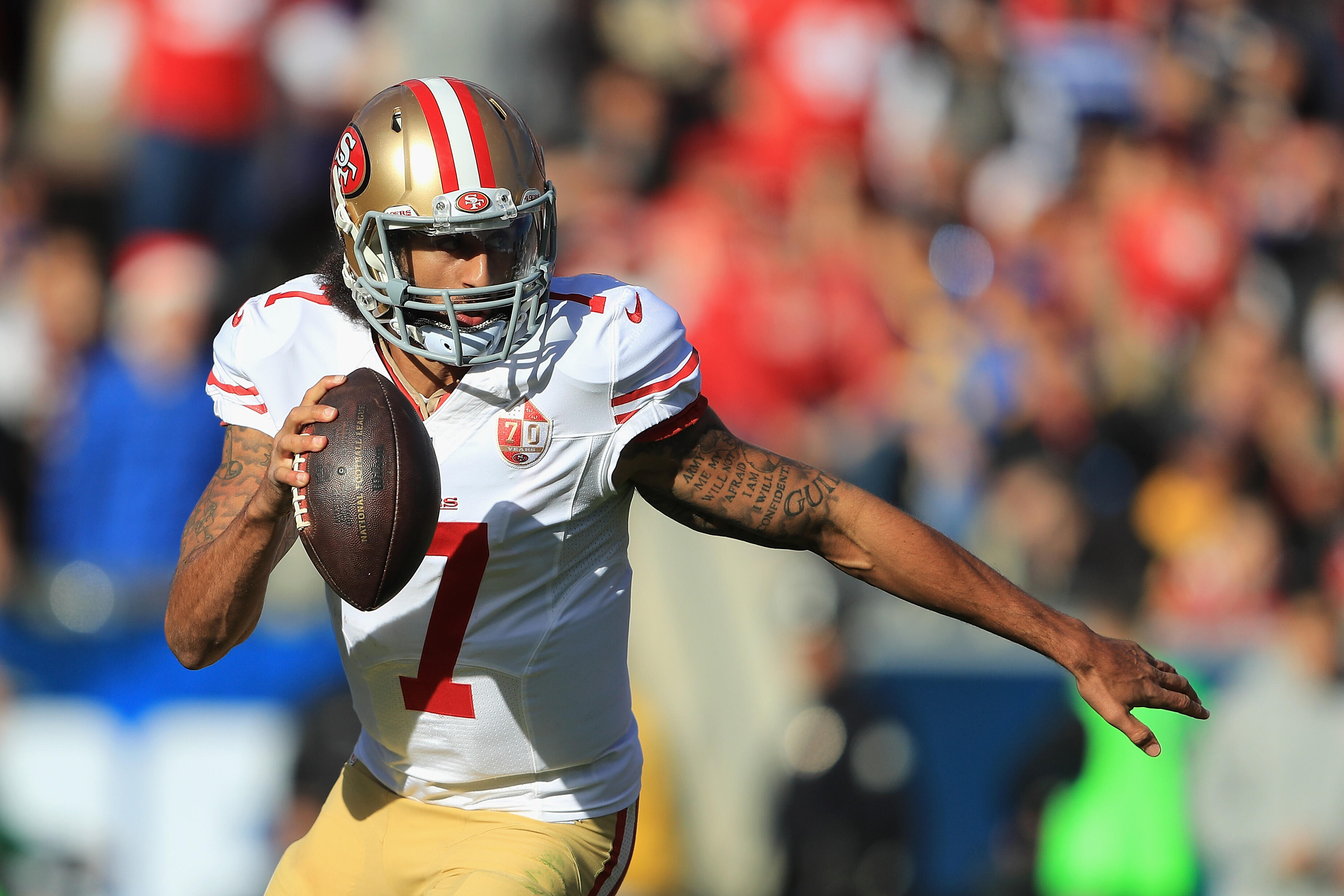 LOS ANGELES, CA - DECEMBER 24:  Colin Kaepernick #7 of the San Francisco 49ers scrambles during the first half against the Los Angeles Rams at Los Angeles Memorial Coliseum on December 24, 2016 in Los Angeles, California.  (Photo by Sean M. Haffey/Getty I