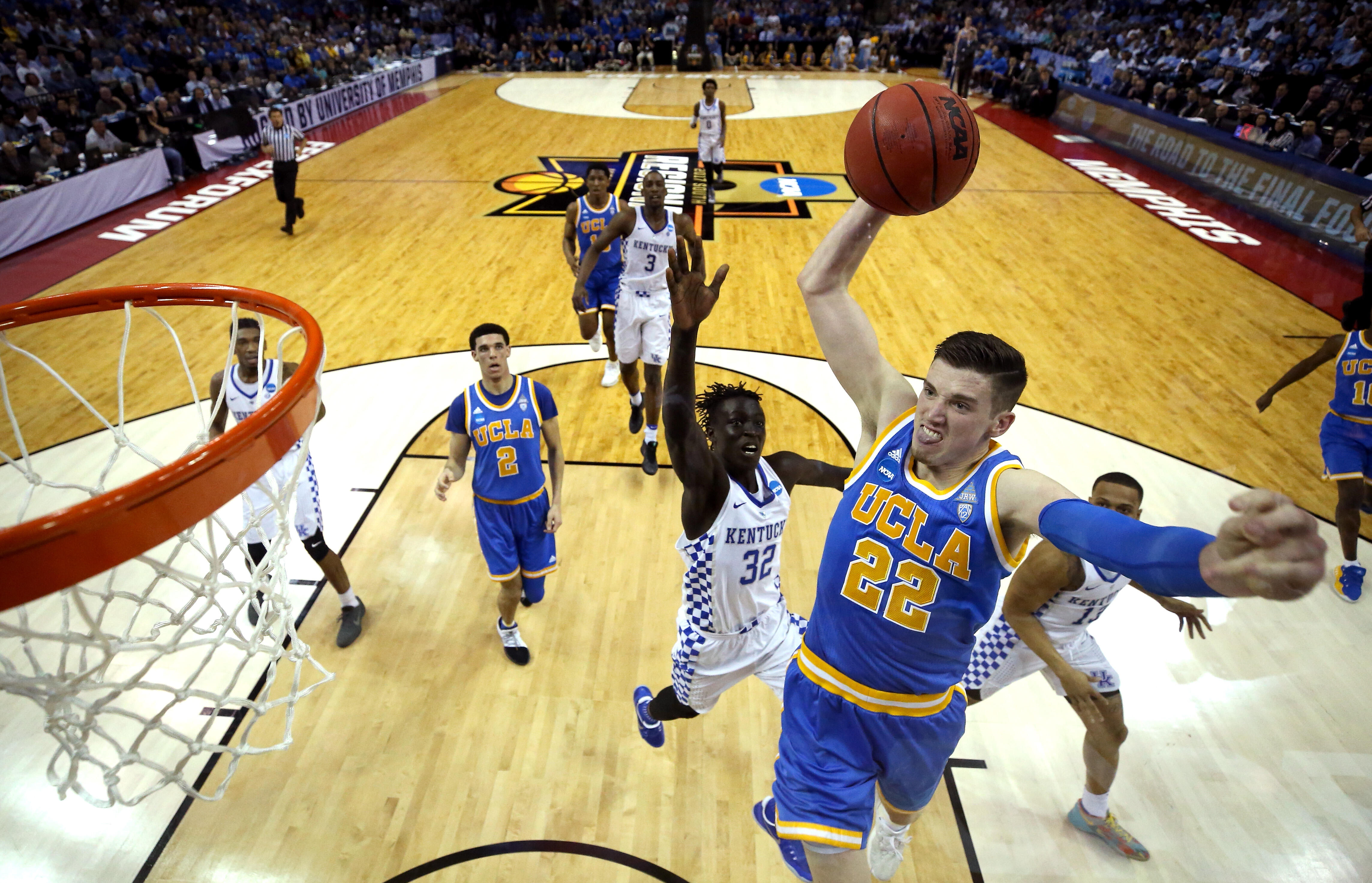 MEMPHIS, TN - MARCH 24: TJ Leaf #22 of the UCLA Bruins goes up for a dunk against Wenyen Gabriel #32 of the Kentucky Wildcats in the first half during the 2017 NCAA Men's Basketball Tournament South Regional at FedExForum on March 24, 2017 in Memphis, Ten