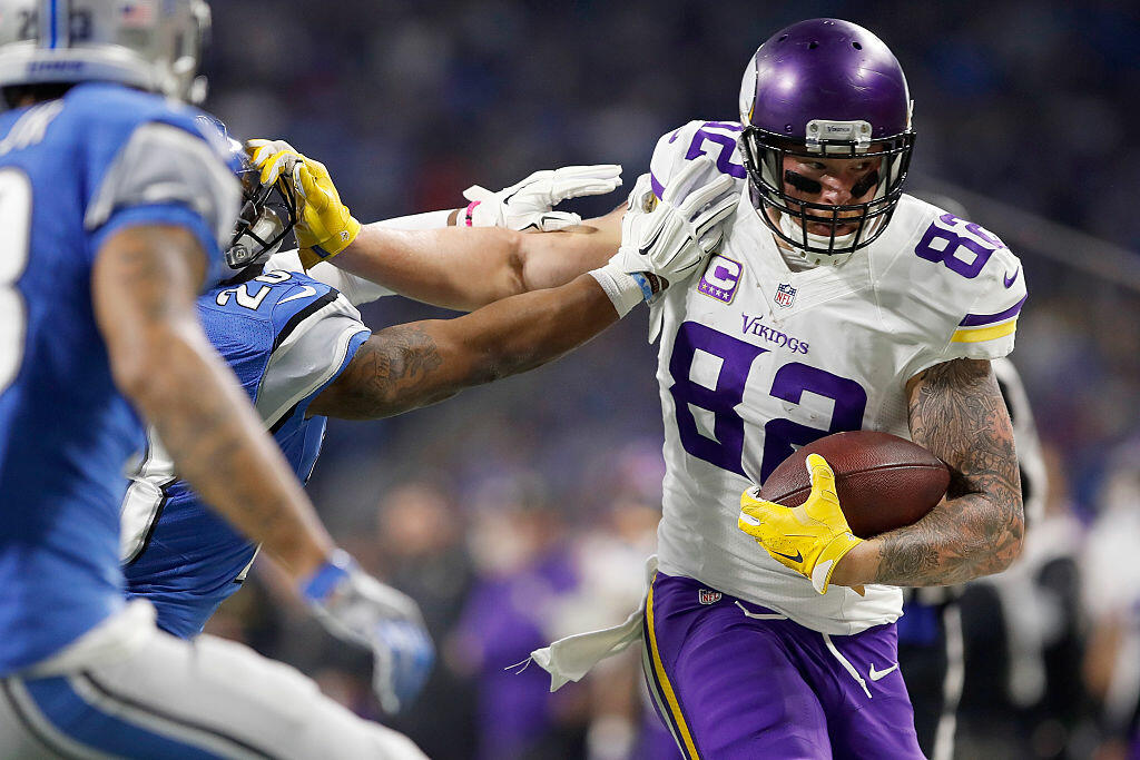DETROIT.MI - NOVEMBER 24: Kyle Rudolph (82) of the Minnesota Vikings runs for yardage against Quandre Diggs (28) of the Detroit Lions and Darius Slay (23) during first quarter action at Ford Field on November 24, 2016 in Detroit, Michigan. (Photo by Gregory Shamus/Getty Images)