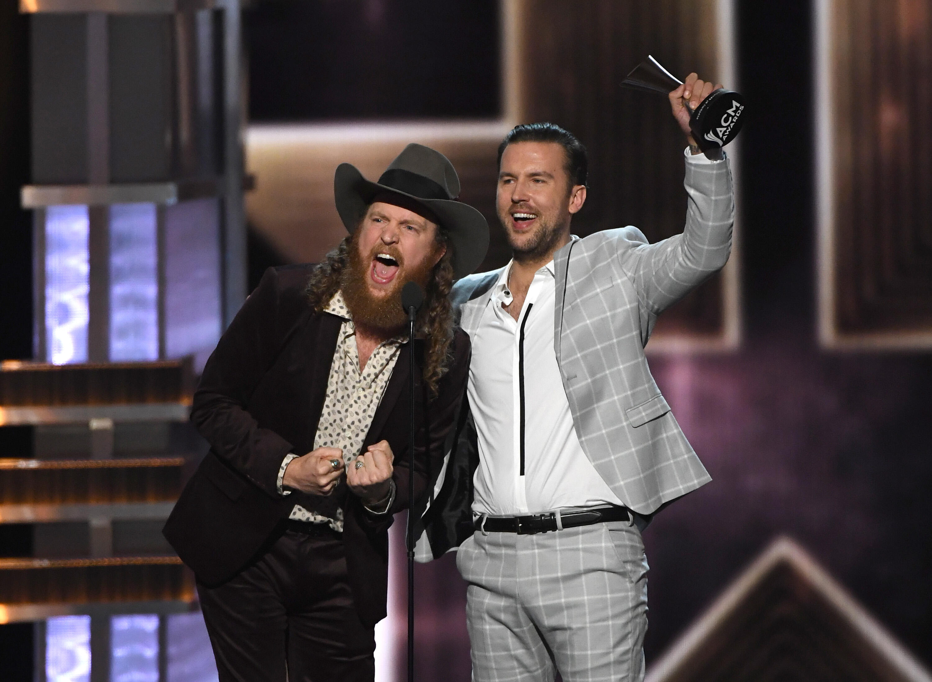 LAS VEGAS, NV - APRIL 02:  Recording artists John Osborne (L) and T.J. Osborne of music group Brothers Osborne accept the Vocal Duo of the Year award onstage during the 52nd Academy Of Country Music Awards at T-Mobile Arena on April 2, 2017 in Las Vegas, 