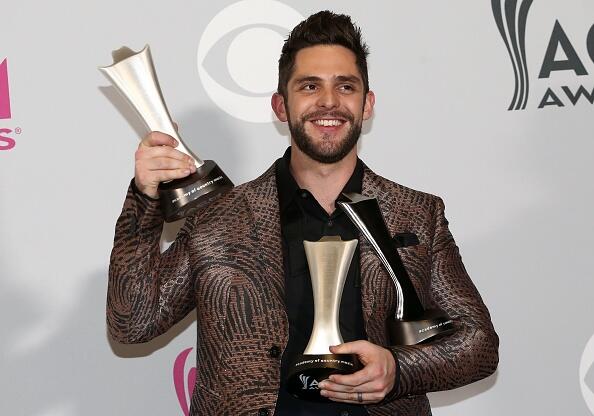 Thomas Rhett poses in the press room with the awards for Male Vocalist of the Year, Song of the Year, artist and Song of the Year, songwriter, at the 52nd Academy of Country Music Awards on April 2, 2017, at the T-Mobile Arena in Las Vegas, Nevada. / AFP PHOTO / Tommaso Boddi        (Photo credit should read TOMMASO BODDI/AFP/Getty Images)
