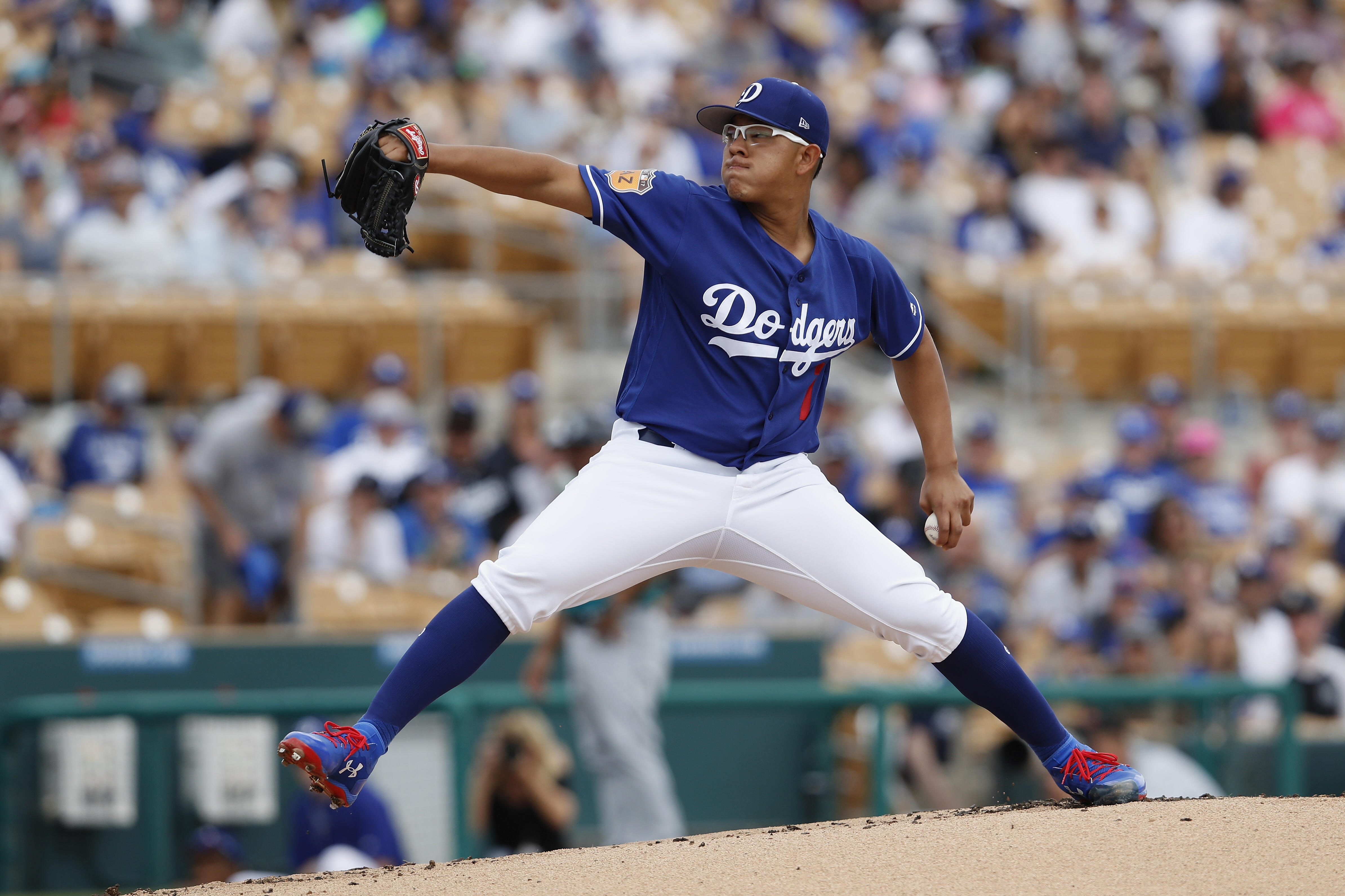 GLENDALE, AZ - MARCH 05:  Julio Urias #7 of the Los Angeles Dodgers pitches in the first inning against the Seattle Mariners during the spring training game at Camelback Ranch on March 5, 2017 in Glendale, Arizona.  (Photo by Tim Warner/Getty Images)