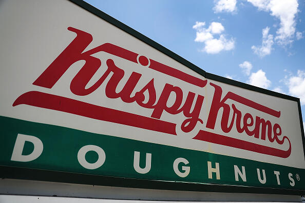 MIAMI, FL - MAY 09: A Krispy Kreme Donuts sign is seen outside of a store on May 09, 2016 in Miami, Florida.  JAB Holdings Company, announced it is acquiring Krispy Kreme Donuts in a deal valued at $1.35 billion.  (Photo by Joe Raedle/Getty Images)