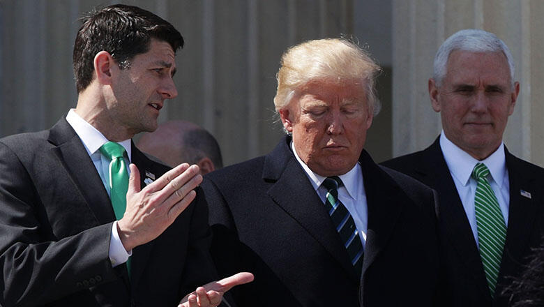 WASHINGTON, DC - MARCH 16:  U.S. President Donald Trump (C), House Speaker Paul Ryan (R-WI) (L) and Vice President Mike Pence walk down the House east front steps after the annual Friends of Ireland luncheon at the Capitol March 16, 2017 in Washington, DC