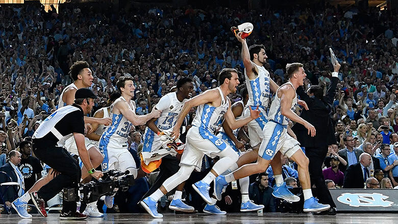 GLENDALE, AZ - APRIL 03: The North Carolina Tar Heels basketball team run on to the court after time expires during the 2017 NCAA Men's Final Four National Championship game at University of Phoenix Stadium on April 3, 2017 in Glendale, Arizona.  (Photo b