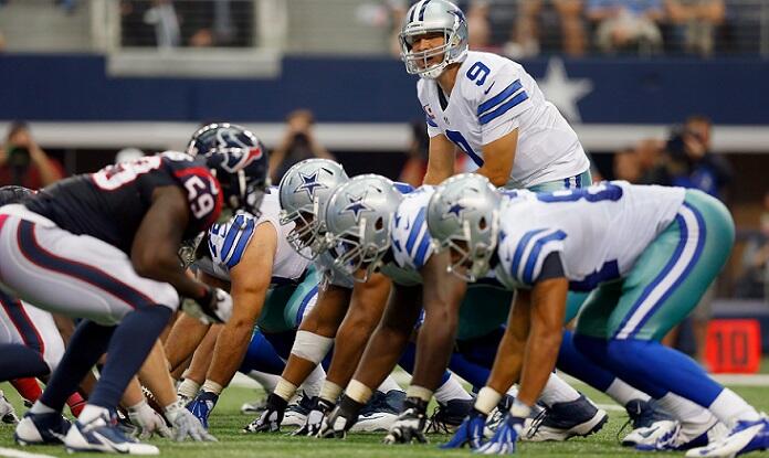 ARLINGTON, TX - OCTOBER 05:  Tony Romo #9 of the Dallas Cowboys leads the Cowboys against the Houston Texans in the secodn half at AT&T Stadium on October 5, 2014 in Arlington, Texas.  (Photo by Tom Pennington/Getty Images)