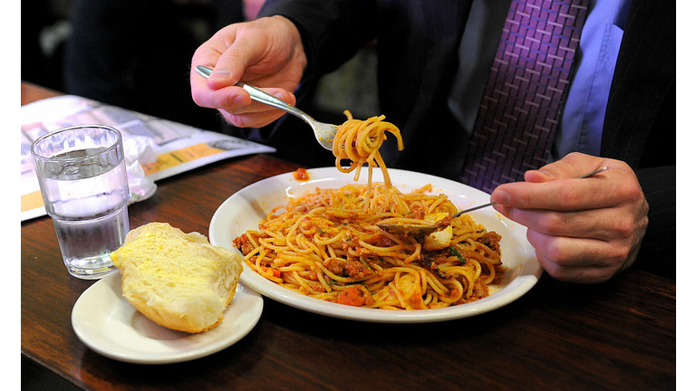 A diner twirls his spaghetti at Pellegri