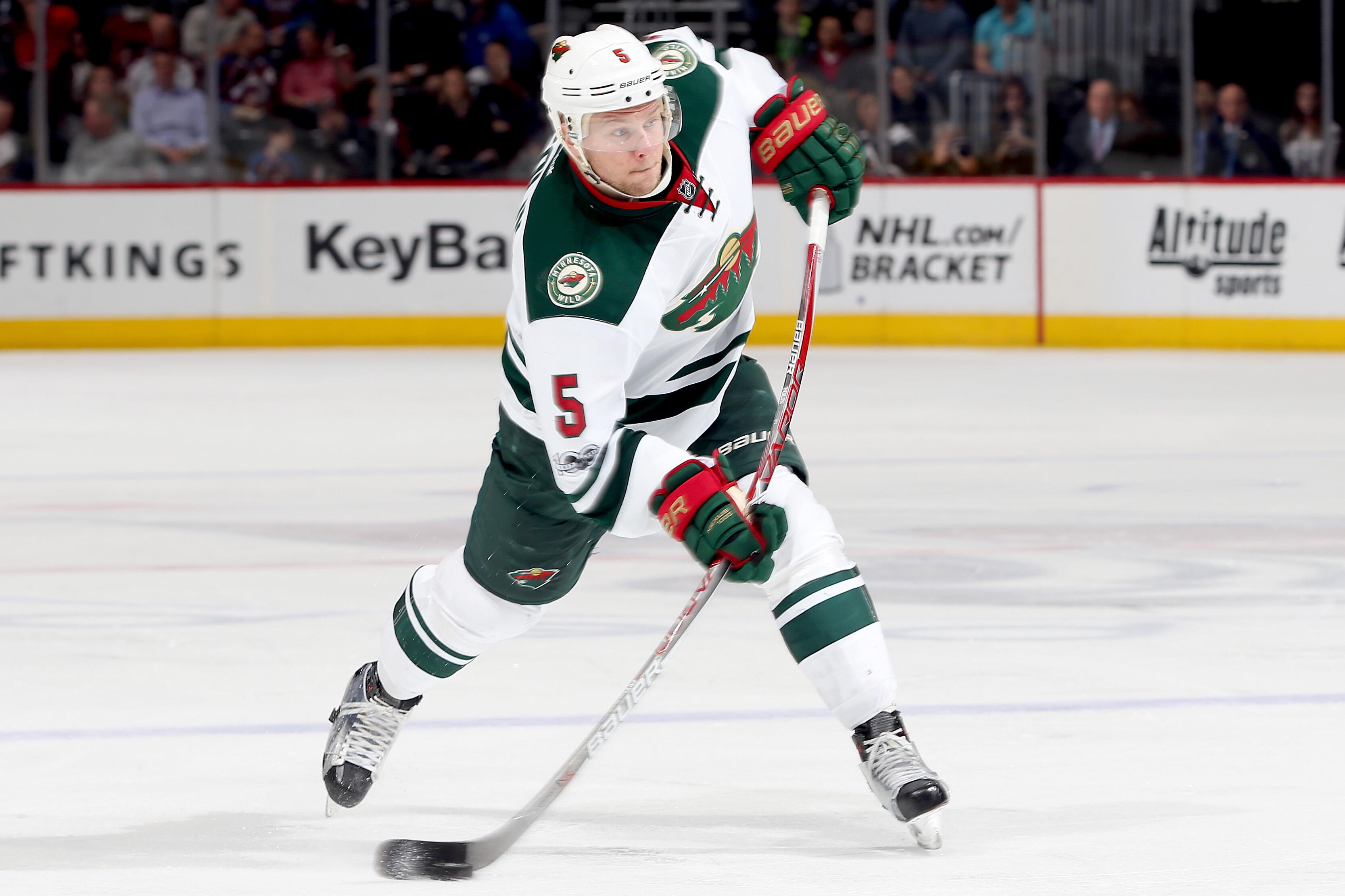 DENVER, CO - APRIL 06:  Christian Folin #5 of the Minnesota Wild fires a shot on goal against the Colorado Avalanche at the Pepsi Center on April 6, 2017 in Denver, Colorado.  (Photo by Matthew Stockman/Getty Images)