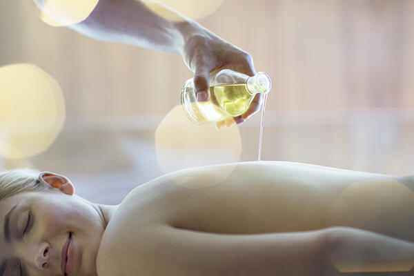 Woman receiving massage at spa