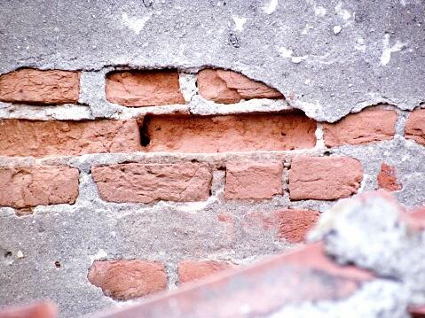 Close-Up Of Damaged Brick Wall