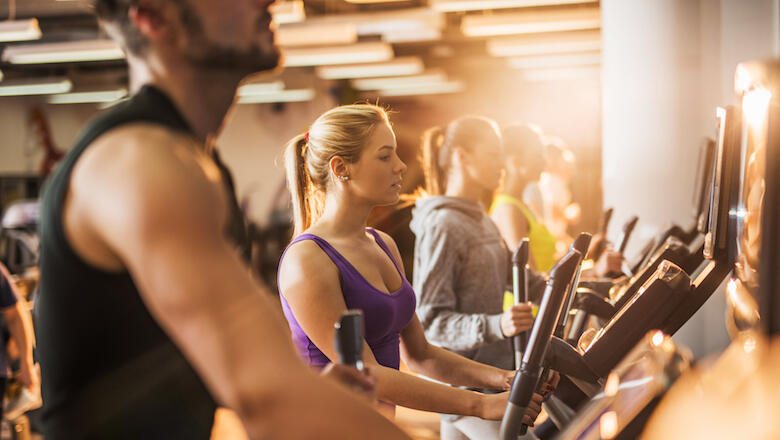 Group of young people exercising in a health club.