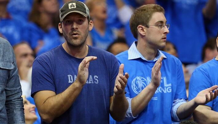 DALLAS, TX - APRIL 28:  (L-R)  Jason Witten and Tony Romo of the Dallas Cowboys watch a game between the San Antonio Spurs and the Dallas Mavericks in Game Four of the Western Conference Quarterfinals during the 2014 NBA Playoffs at American Airlines Cent