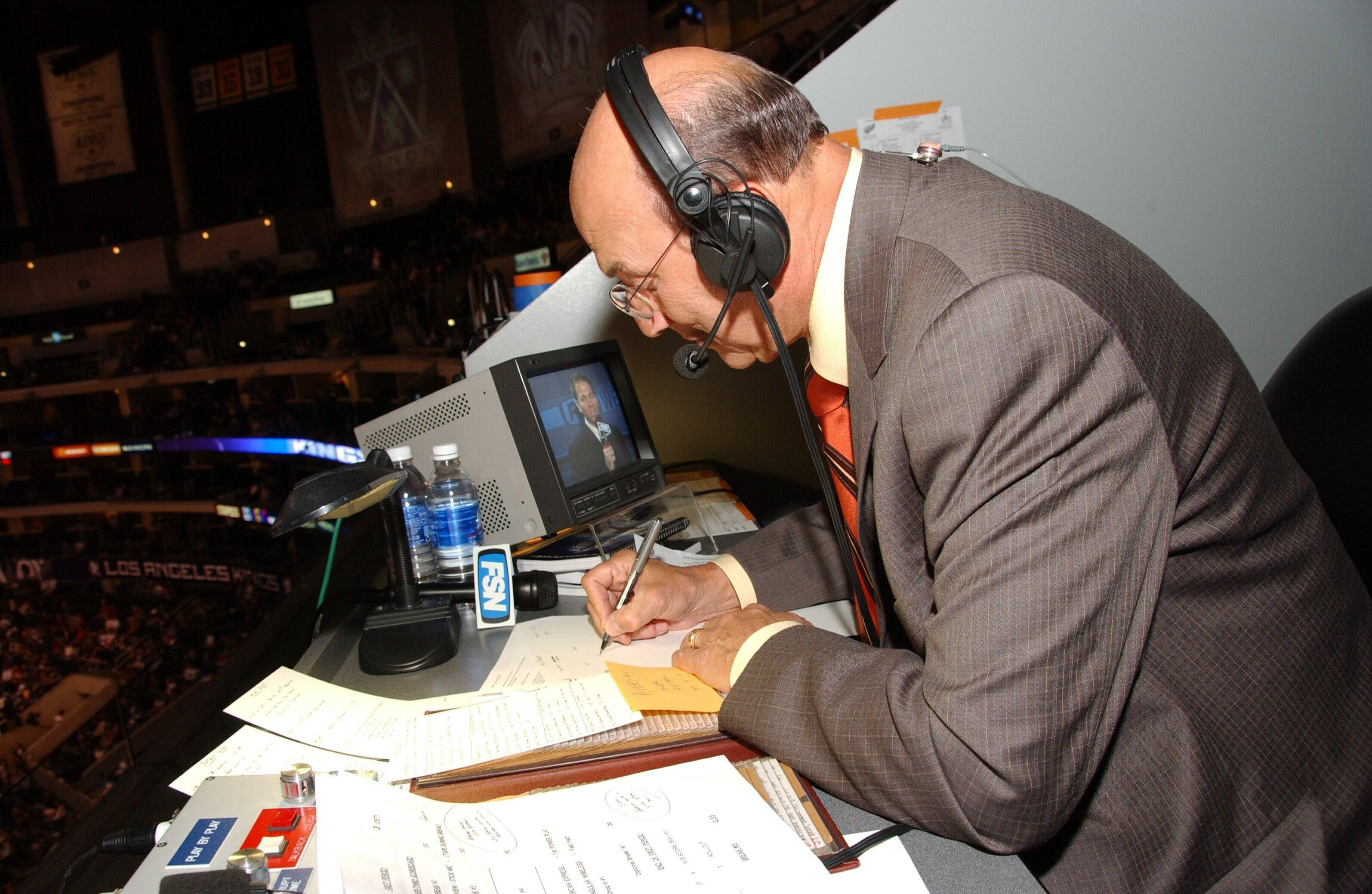 LOS ANGELES - OCTOBER 16:  Los Angeles Kings announcer Bob Miller goes over game notes during the game against the Detroit Red Wings on October 16, 2006 at the Staples Center in Los Angeles, California.  The Red Wings won 3-1.  (Photo by Andrew D. Bernste