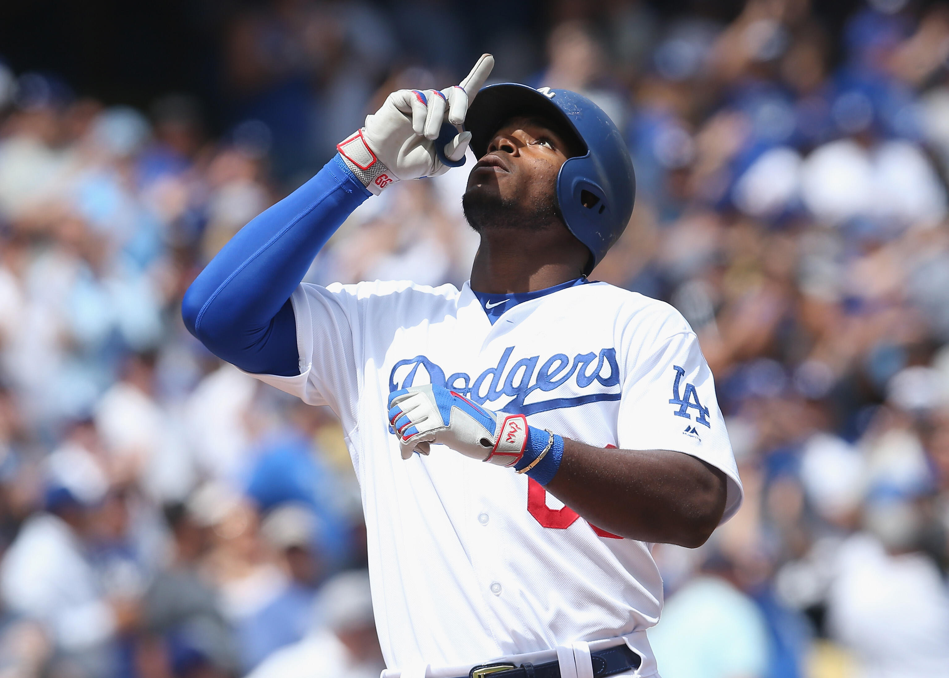 LOS ANGELES, CALIFORNIA - APRIL 06:  Yasiel Puig #66 of the Los Angeles Dodgers celebrates as he crosses home play after hitting a two run home run in the second inning against the San Diego Padres at Dodger Stadium on April 6, 2017 in Los Angeles, Califo