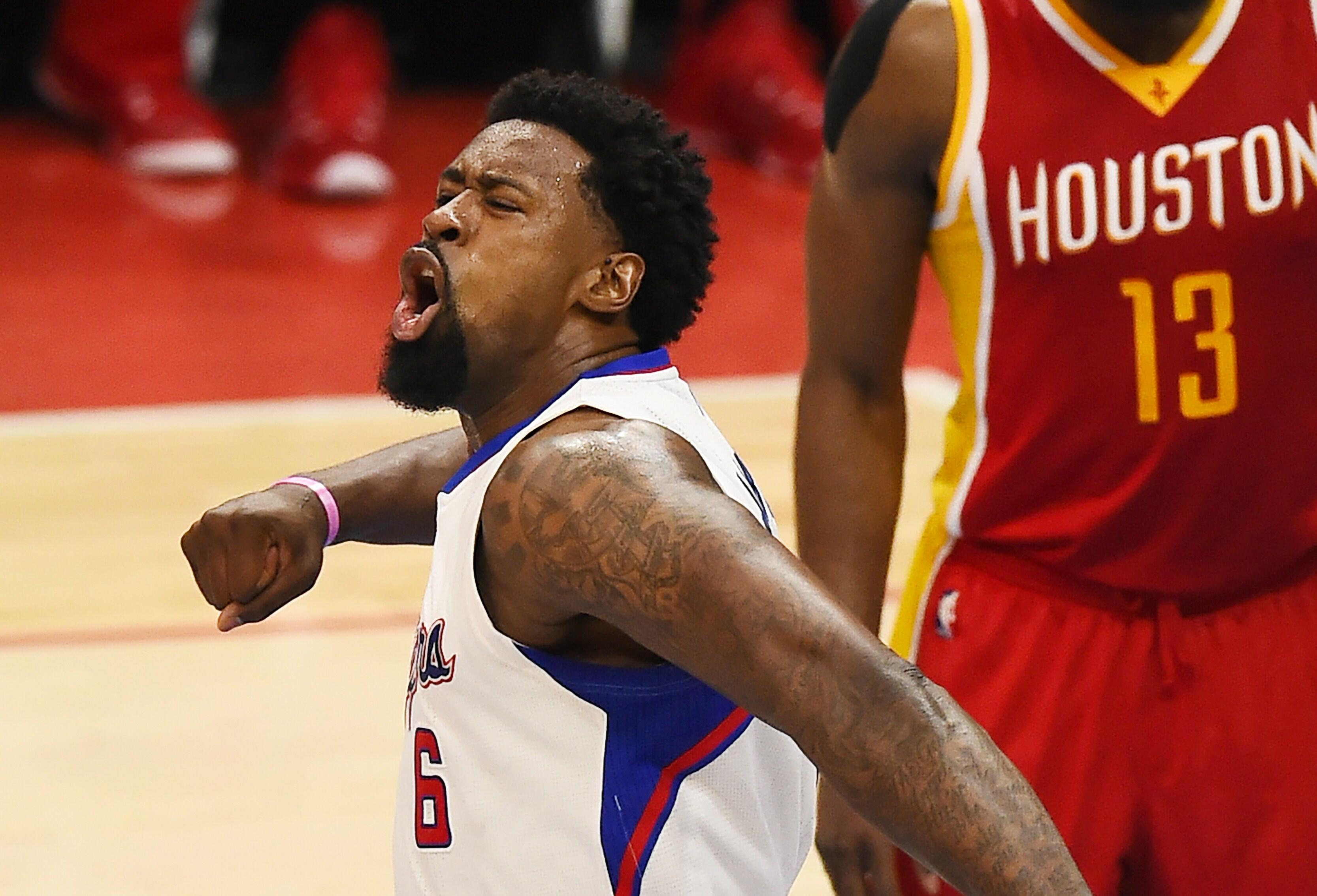 Los Angeles Clippers DeAndre Jordan reacts during NBA playoff Game Four against the Houston Rockets, May 10, 2015 at Staples Center in Los Angeles, California. The Clippers defeated the Rockets 128-95 to lead the series 3-1.   AFP PHOTO / ROBYN BECK      