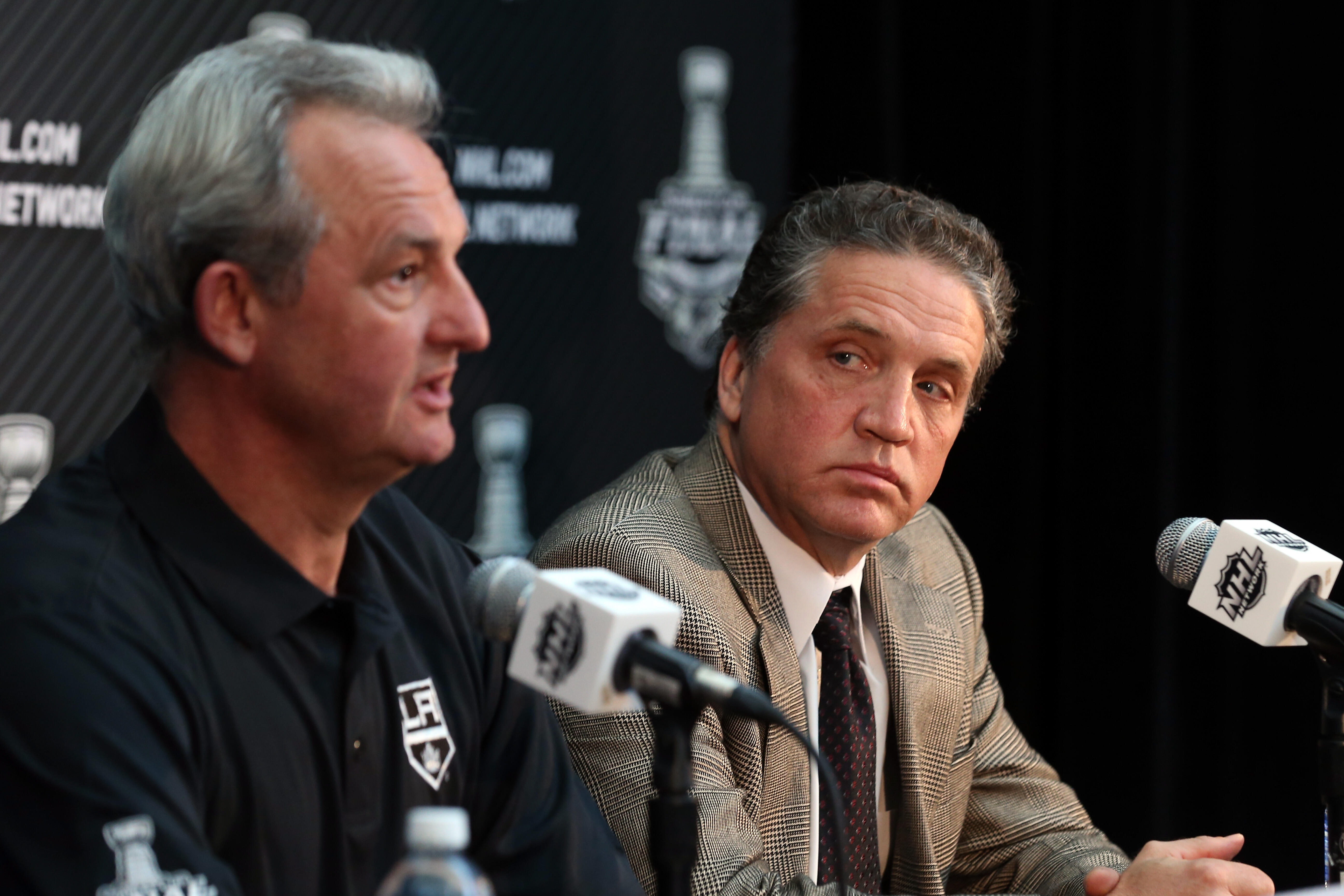 LOS ANGELES, CA - JUNE 03:  Head Coach Darryl Sutter and President and General Manager Dean Lombardi of the Los Angeles Kings speak during Media Day for the 2014 NHL Stanley Cup Final at Staples Center on June 3, 2014 in Los Angeles, California.  (Photo b
