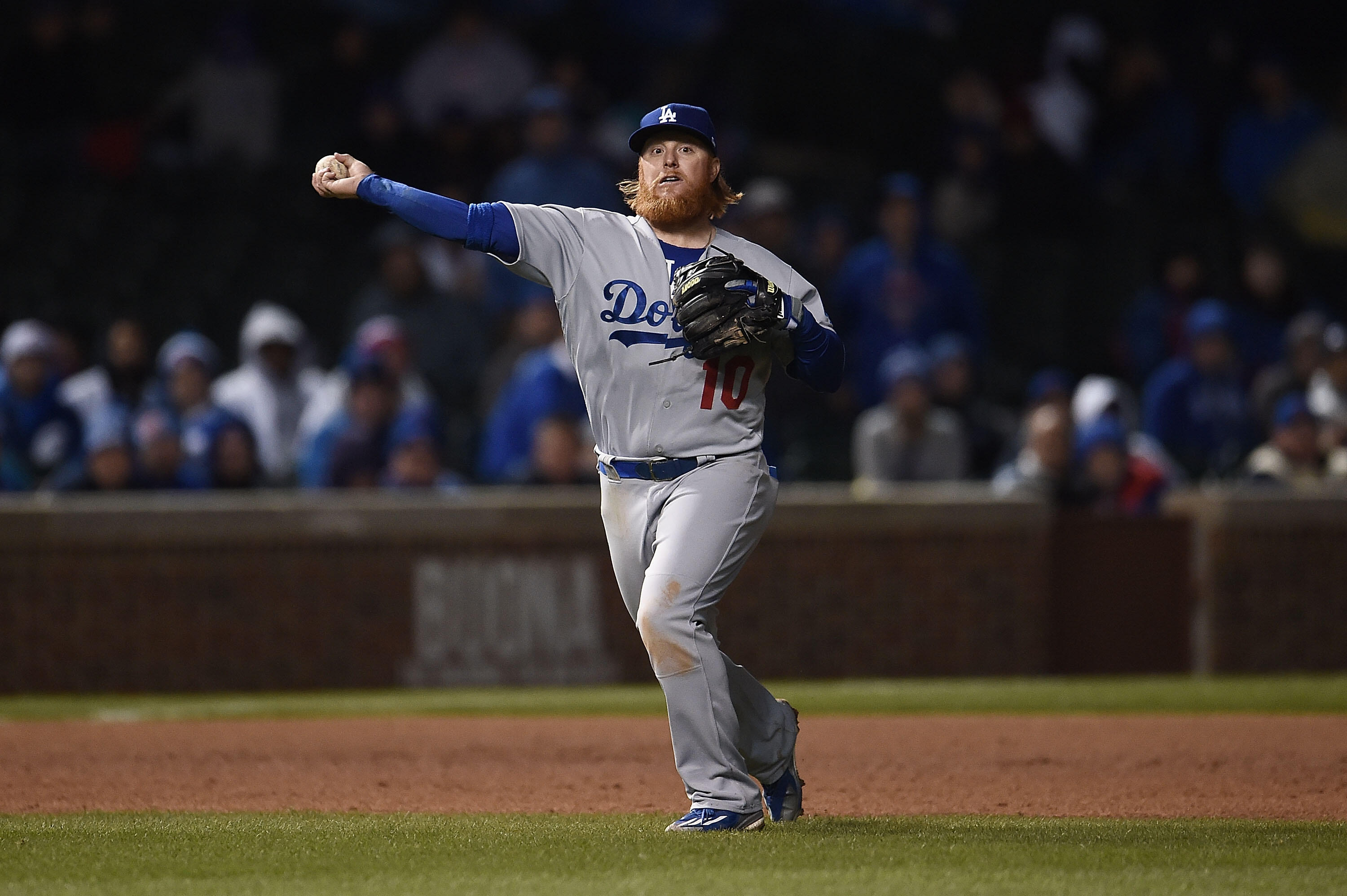 CHICAGO, IL - APRIL 10:  Justin Turner #10 of the Los Angeles Dodgers makes a throw to first base during the sixth inning of a game against the Chicago Cubs at Wrigley Field on April 10, 2017 in Chicago, Illinois.  (Photo by Stacy Revere/Getty Images)