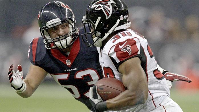 HOUSTON, TX- AUGUST 16: Max Bullough #53 of the Houston Texans eyes Josh Vaughan #30 of the Atlanta Falcons in the third quarter in a pre-season NFL game on August 16, 2014 at NRG Stadium in Houston, Texas. (Photo by Bob Levey/Getty Images)