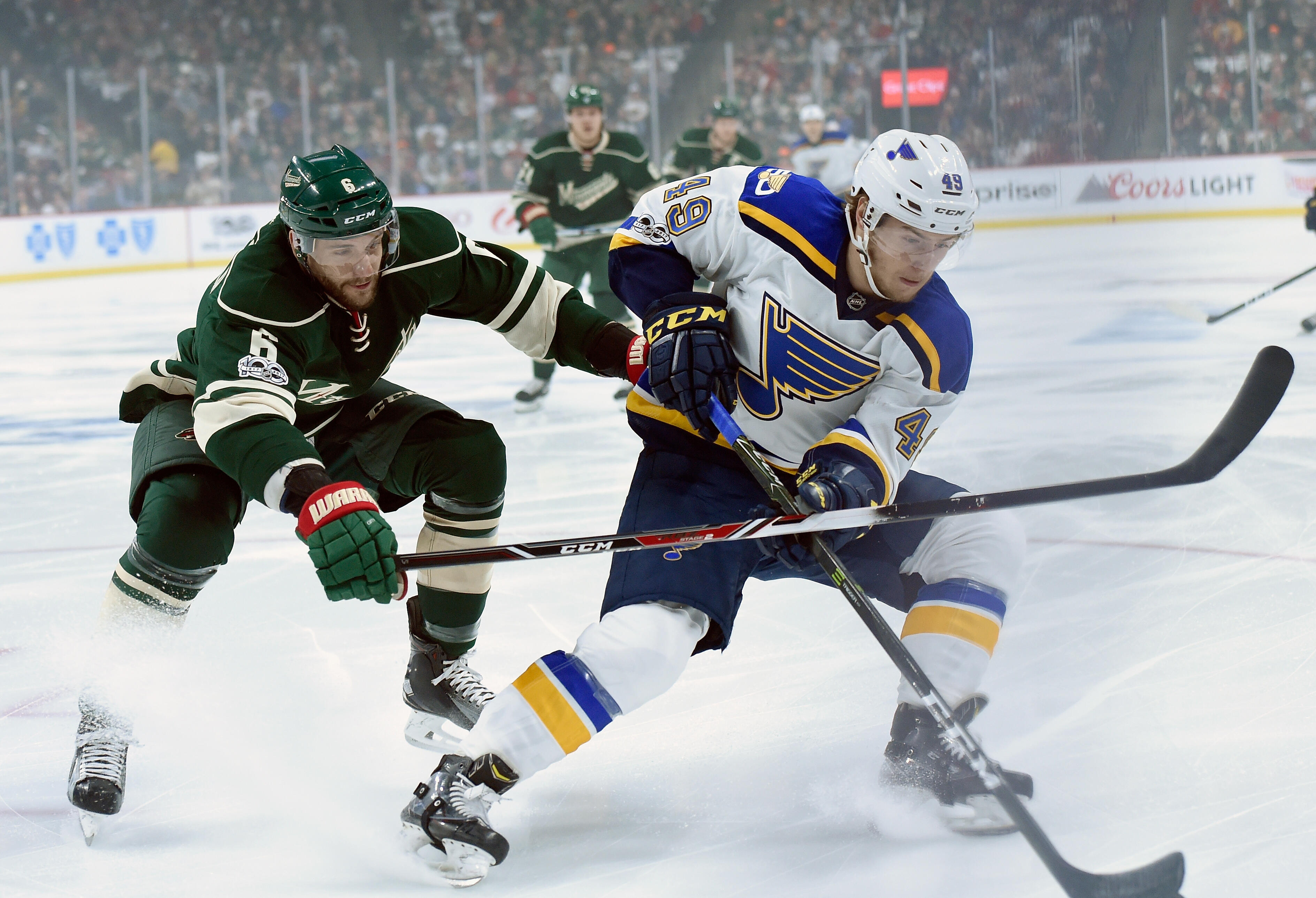 ST PAUL, MN - APRIL 12: Ivan Barbashev #49 of the St. Louis Blues controls the puck against Marco Scandella #6 of the Minnesota Wild during the first period in Game One of the Western Conference First Round during the 2017 NHL Stanley Cup Playoffs at Xcel