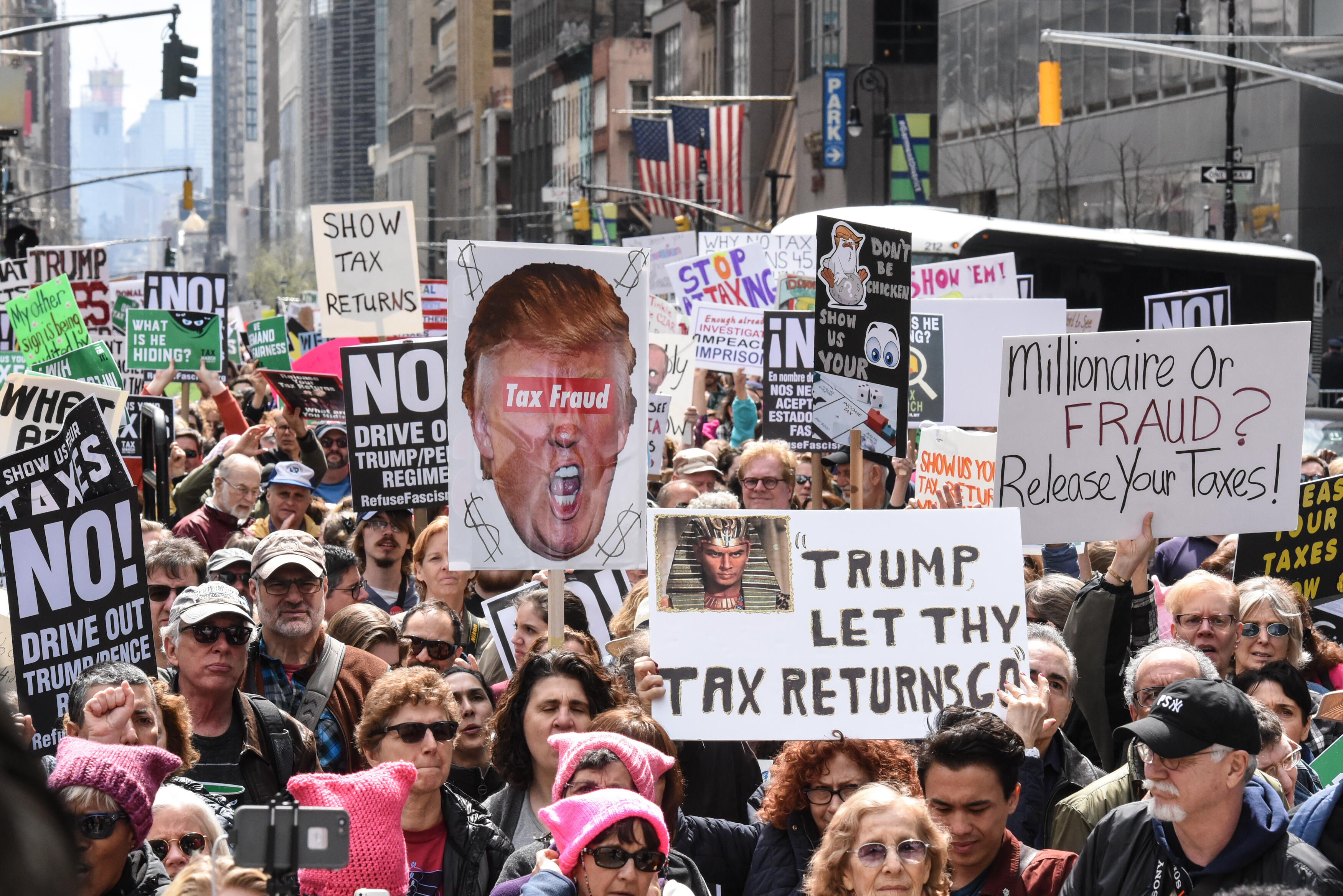 NEW YORK, NY - APRIL 15: People participate in a Tax Day protest on April 15, 2017 in New York City. Activists in cities across the nation are marching today to call on President Donald Trump to release his tax returns. (Photo by Stephanie Keith/Getty Ima
