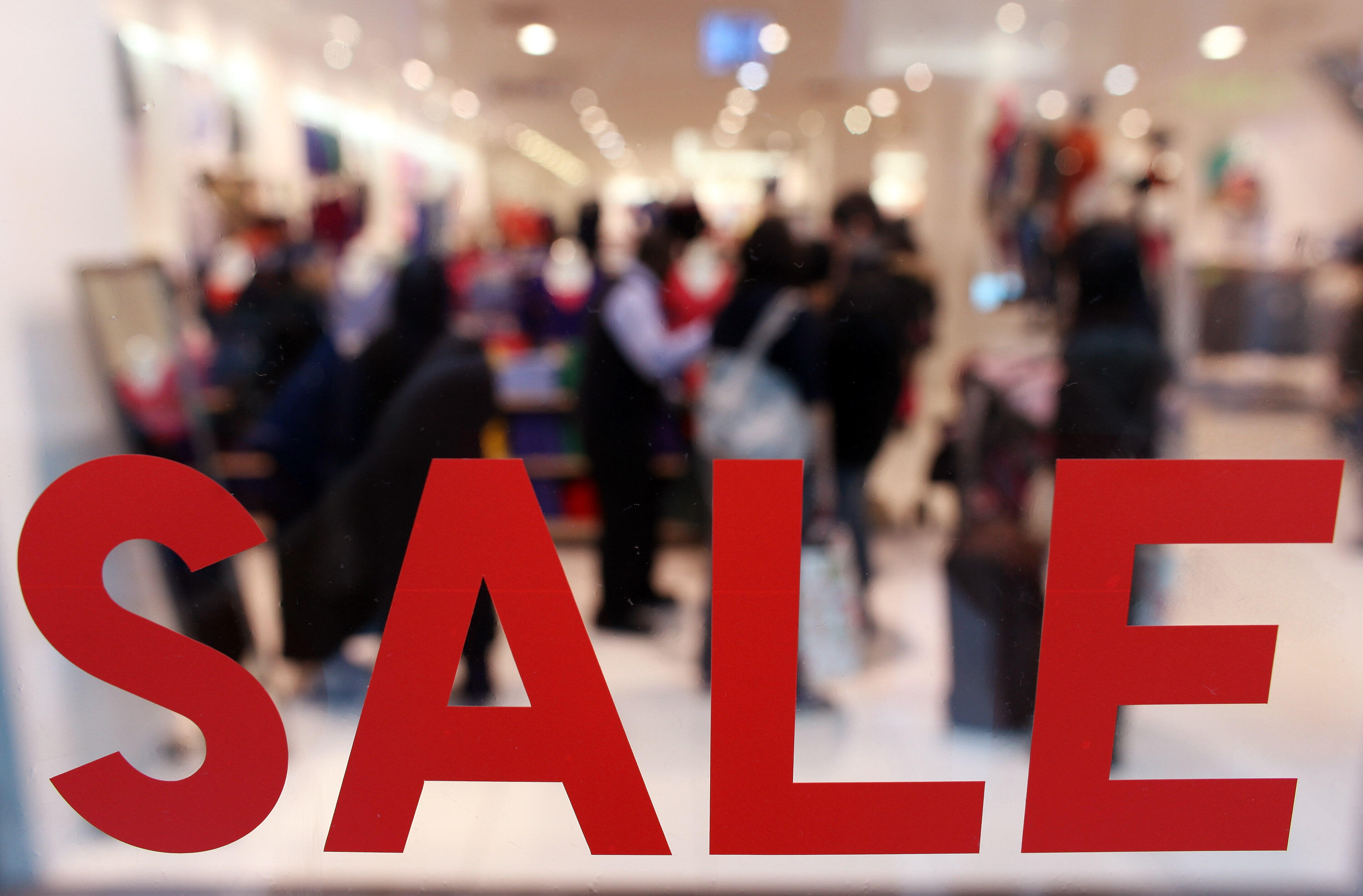 LONDON, ENGLAND - JANUARY 02:  Shoppers peruse the sales in the giant Westfield shopping centre on January 2, 2010 in London, England. High street retailers have reported better than expected post-Christmas trading which has been helped by many businesses