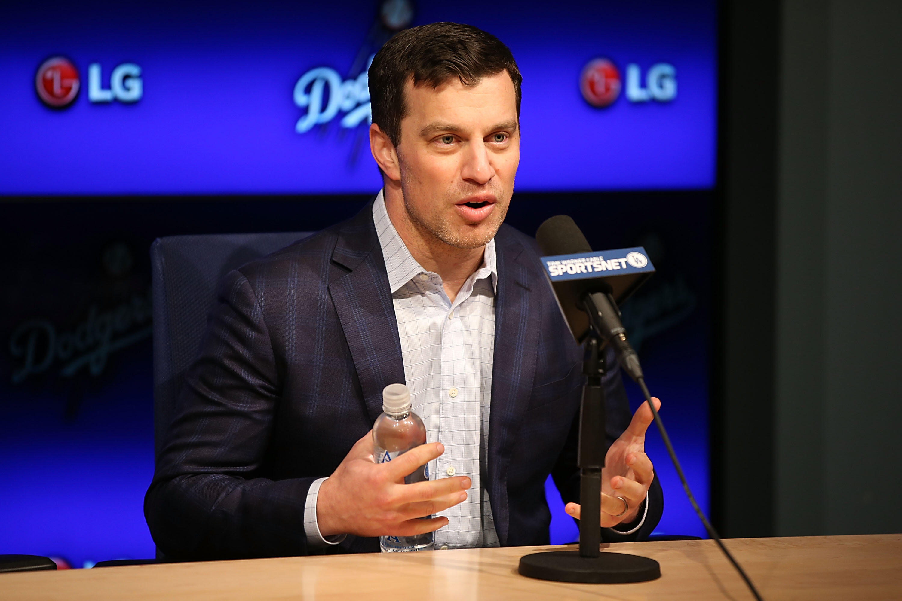 LOS ANGELES, CA - JANUARY 07:  Dodgers president of baseball operations Andrew Friedman introduces Pitcher Kenta Maeda to the Los Angeles Dodgers at Dodger Stadium on January 7, 2016 in Los Angeles, California.  (Photo by Joe Scarnici/Getty Images)