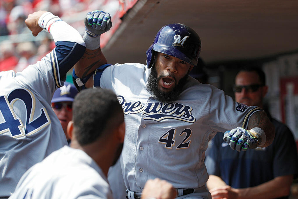 CINCINNATI, OH - APRIL 15: Eric Thames #7 of the Milwaukee Brewers celebrates in the dugout after hitting a solo home run to tie the game in the third inning against the Cincinnati Reds at Great American Ball Park on April 15, 2017 in Cincinnati, Ohio. All players are wearing #42 in honor of Jackie Robinson Day. (Photo by Joe Robbins/Getty Images)