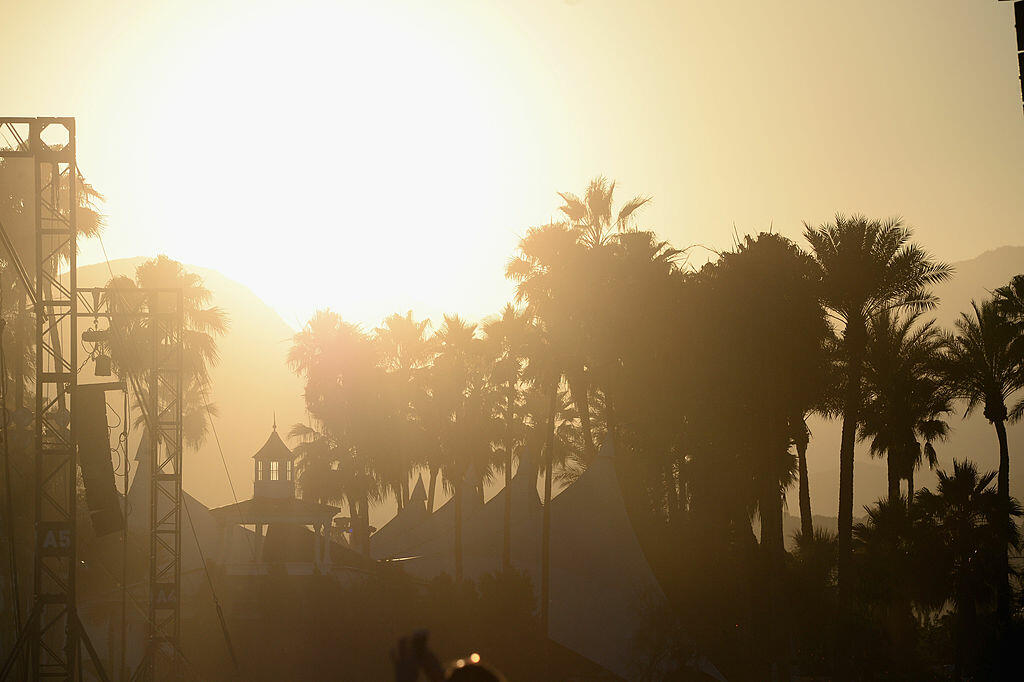 INDIO, CA - APRIL 11:  Sun sets over palm trees during day 1 of the 2014 Coachella Valley Music & Arts Festival at the Empire Polo Club on April 11, 2014 in Indio, California.  (Photo by Frazer Harrison/Getty Images for Coachella)