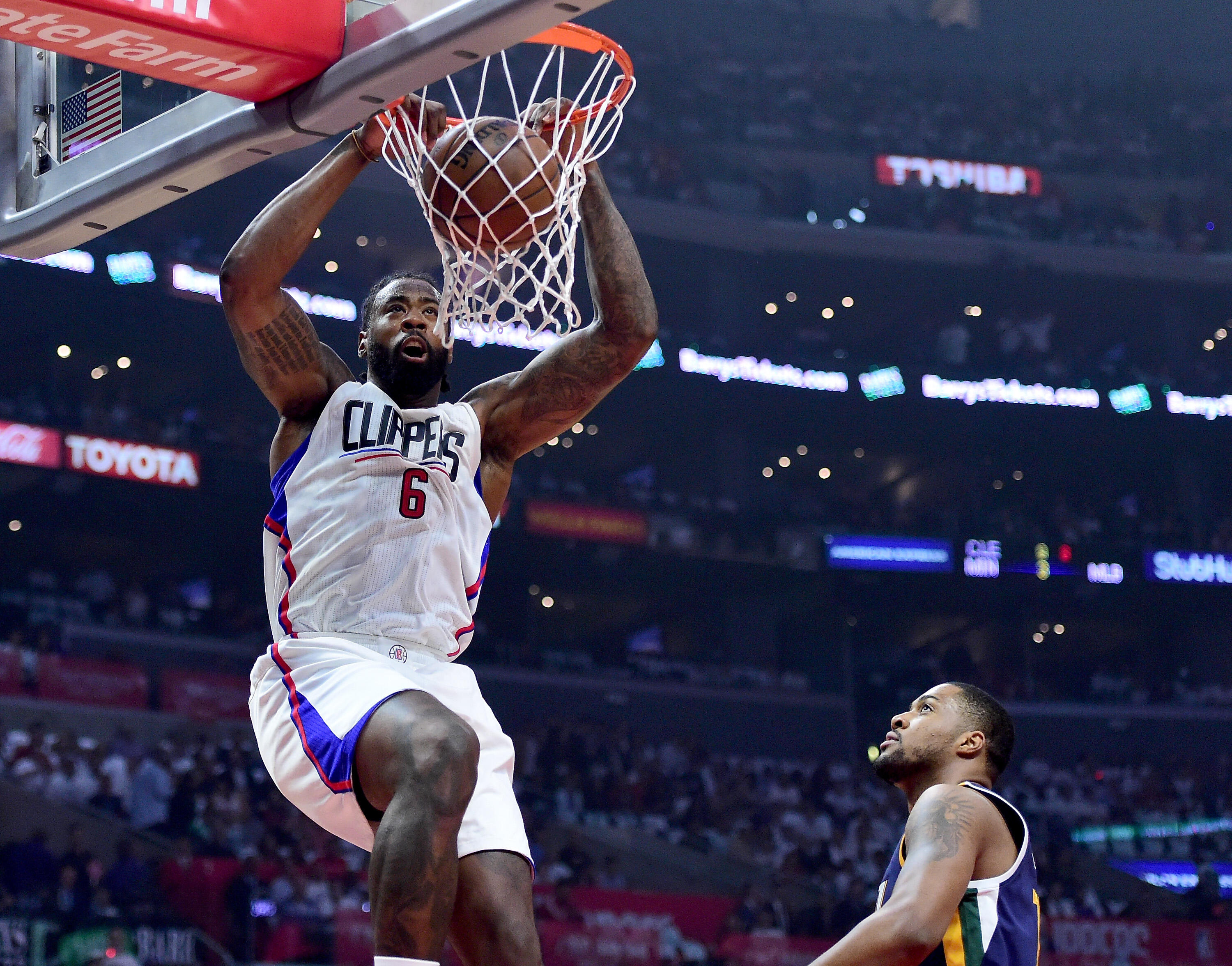 LOS ANGELES, CA - APRIL 18:  DeAndre Jordan #6 of the LA Clippers dunks in front of Derrick Favors #15 of the Utah Jazz during the first half in Game Two of the Western Conference Quarterfinals during the 2017 NBA Playoffs at Staples Center on April 18, 2