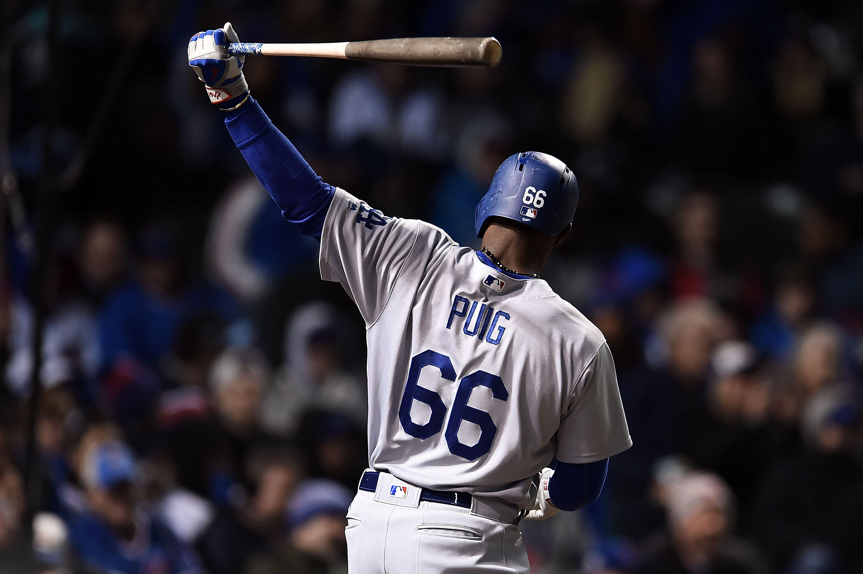 CHICAGO, IL - APRIL 12:  Yasiel Puig #66 of the Los Angeles Dodgers warms up prior to an at bat against the Chicago Cubs during the sixth inning of a game at Wrigley Field on April 12, 2017 in Chicago, Illinois.  (Photo by Stacy Revere/Getty Images)