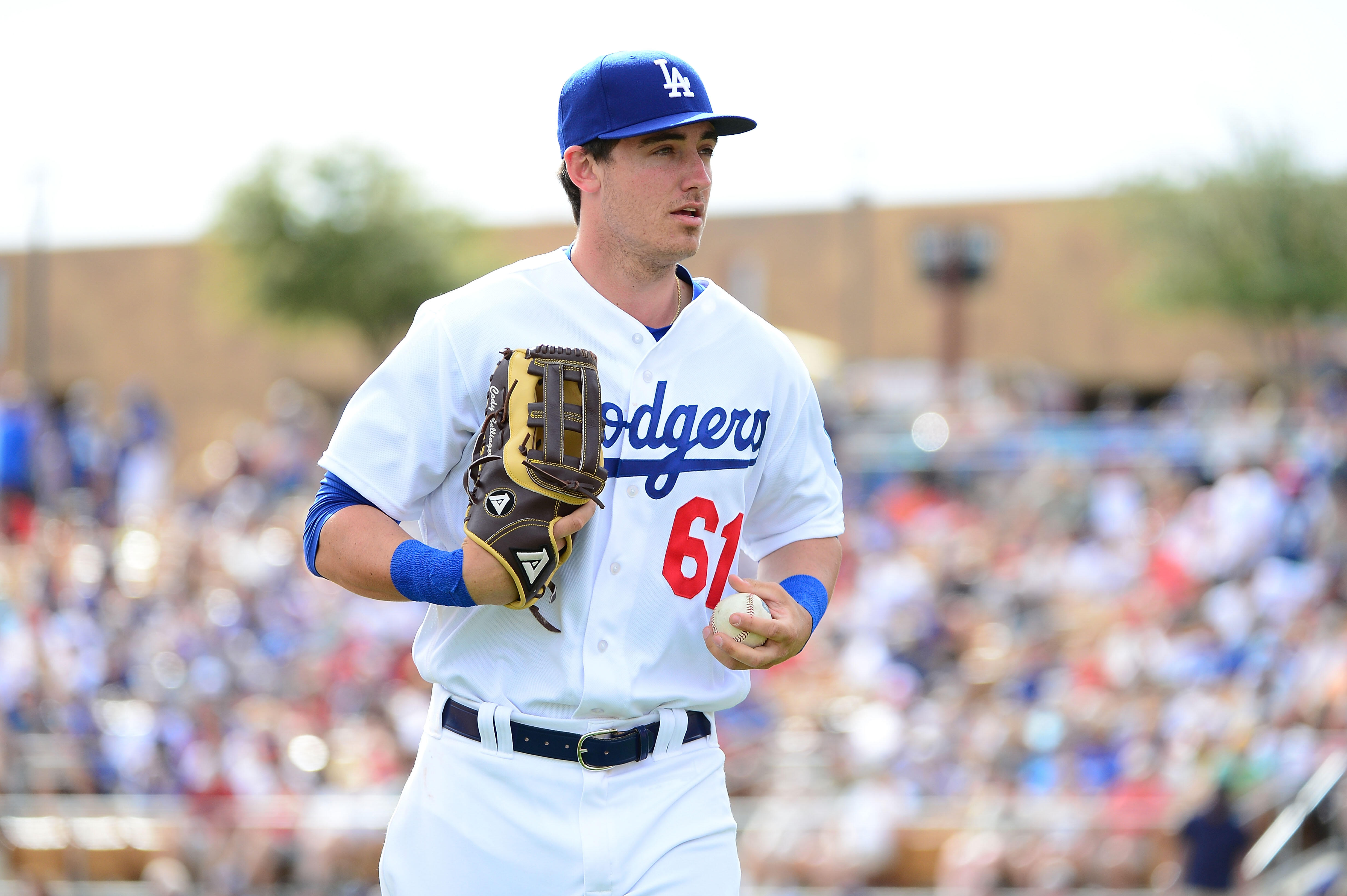 GLENDALE, AZ - MARCH 05:  Cody Bellinger #61 of the Los Angeles Dodgers jogs to the dugout during the spring training game at Camelback Ranch on March 5, 2016 in Glendale, Arizona.  The Dodgers won 7-2.  (Photo by Jennifer Stewart/Getty Images)