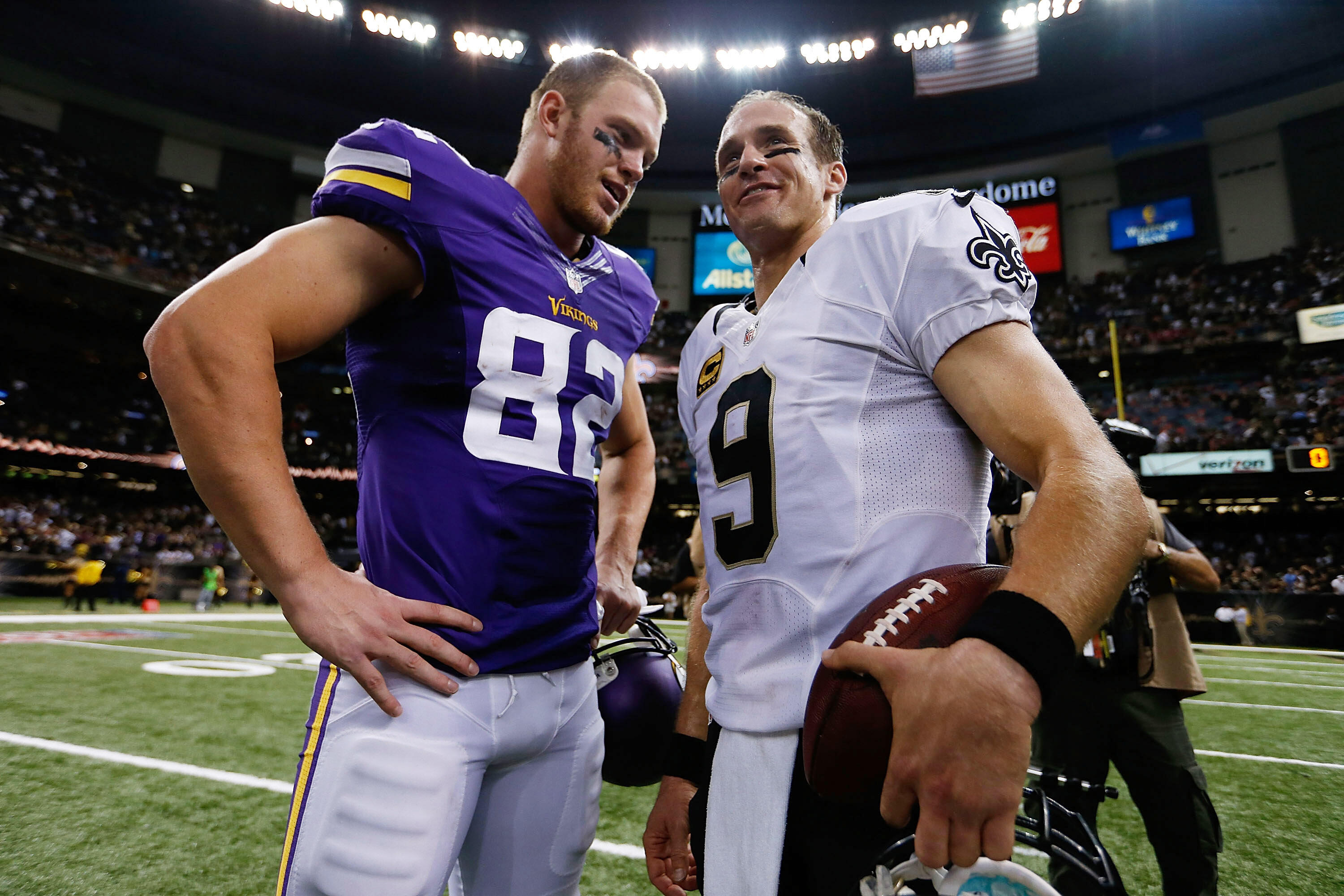 NEW ORLEANS, LA - SEPTEMBER 21:  Drew Brees #9 of the New Orleans Saints speaks with Kyle Rudolph #82 of the Minnesota Vikings following a game at the Mercedes-Benz Superdome on September 21, 2014 in New Orleans, Louisiana.  (Photo by Sean Gardner/Getty I