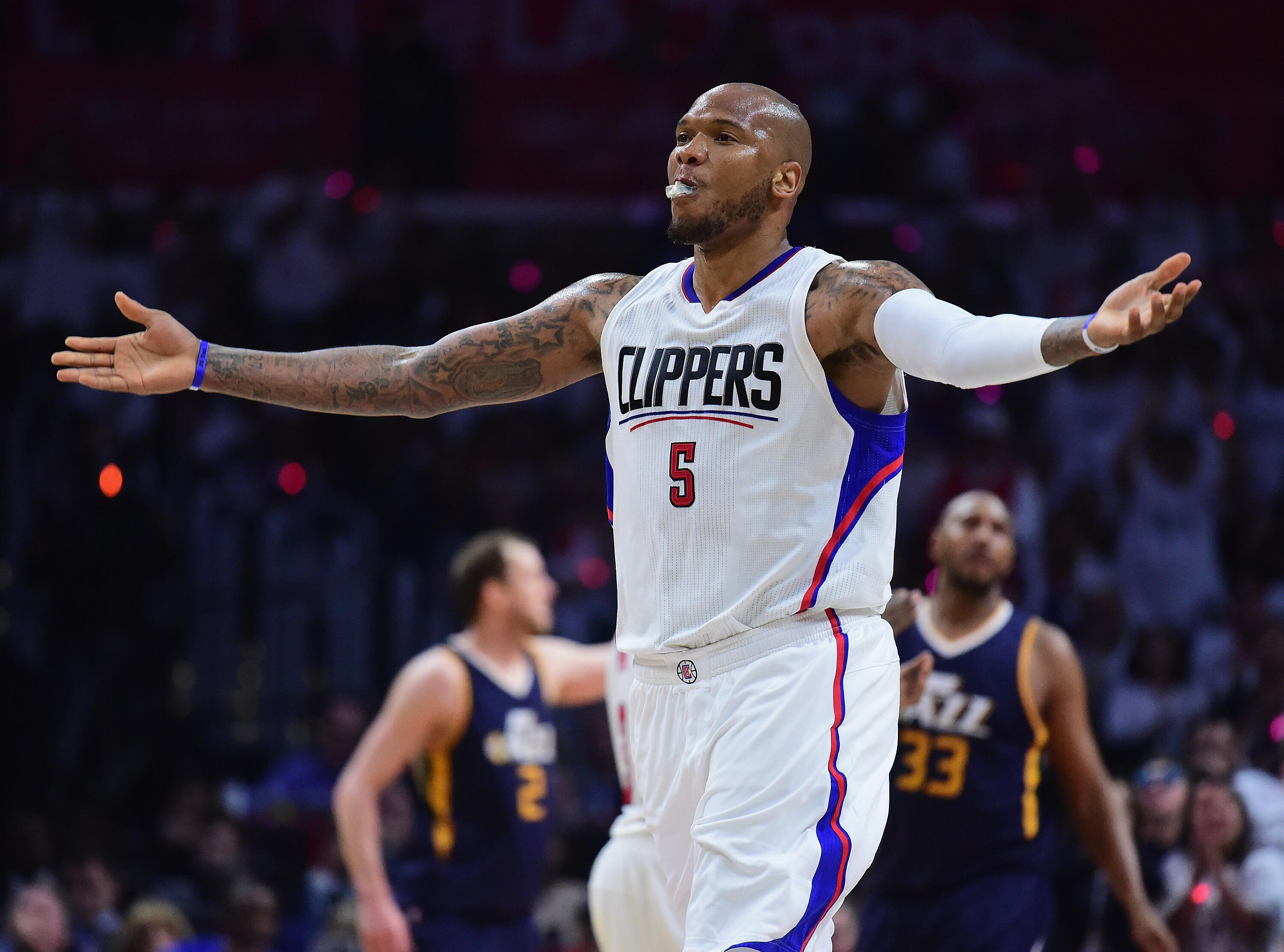 LOS ANGELES, CA - APRIL 15:  Marreese Speights #5 of the LA Clippers celebrates his pass for a dunk to DeAndre Jordan #6 during a 97-95 Jazz win at Staples Center on April 15, 2017 in Los Angeles, California.  NOTE TO USER: User expressly acknowledges and