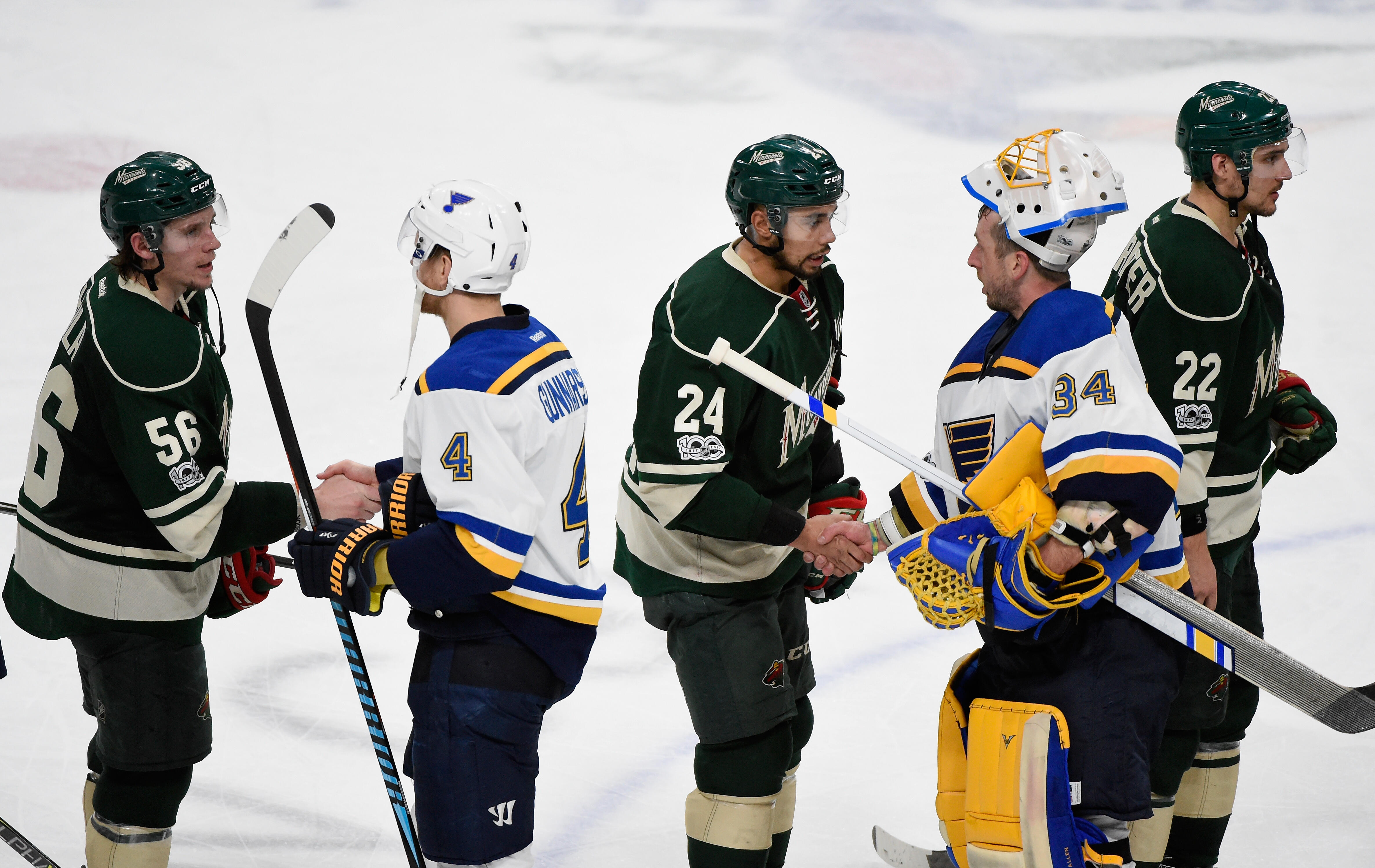 ST PAUL, MN - APRIL 22: Eric Haula #56, Matt Dumba #24 and Nino Niederreiter #22 of the Minnesota Wild shake hands with Carl Gunnarsson #4 and goalie Jake Allen #34 of the St. Louis Blues after Game Five of the Western Conference First Round during the 20