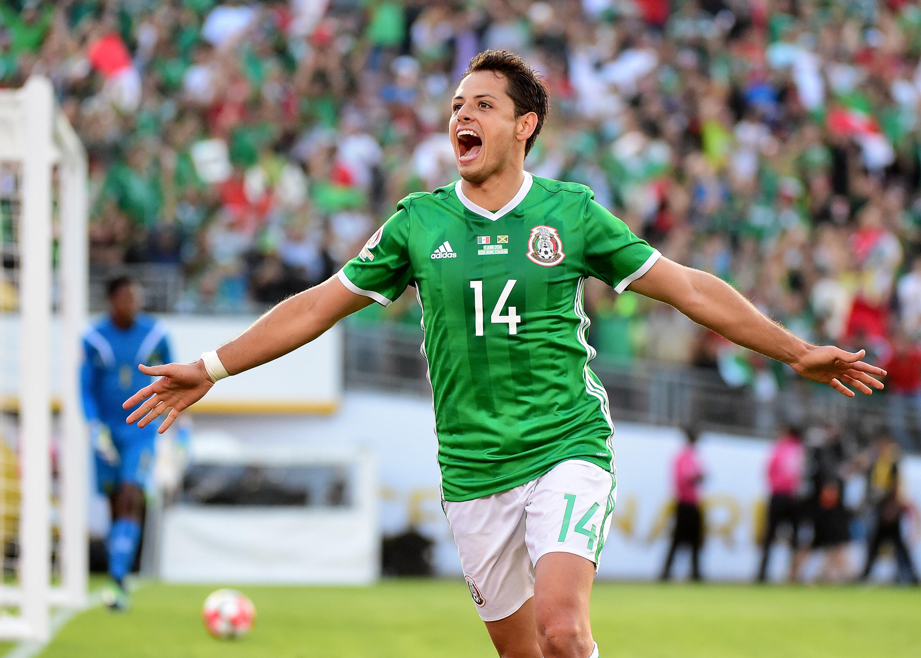 PASADENA, CA - JUNE 09:  Chicharito #14 of Mexico celebrates after his goal in front of Andre Blake #1 of Jamaica to take a 1-0 lead during Copa America Centenario at the Rose Bowl on June 9, 2016 in Pasadena, California.  (Photo by Harry How/Getty Images