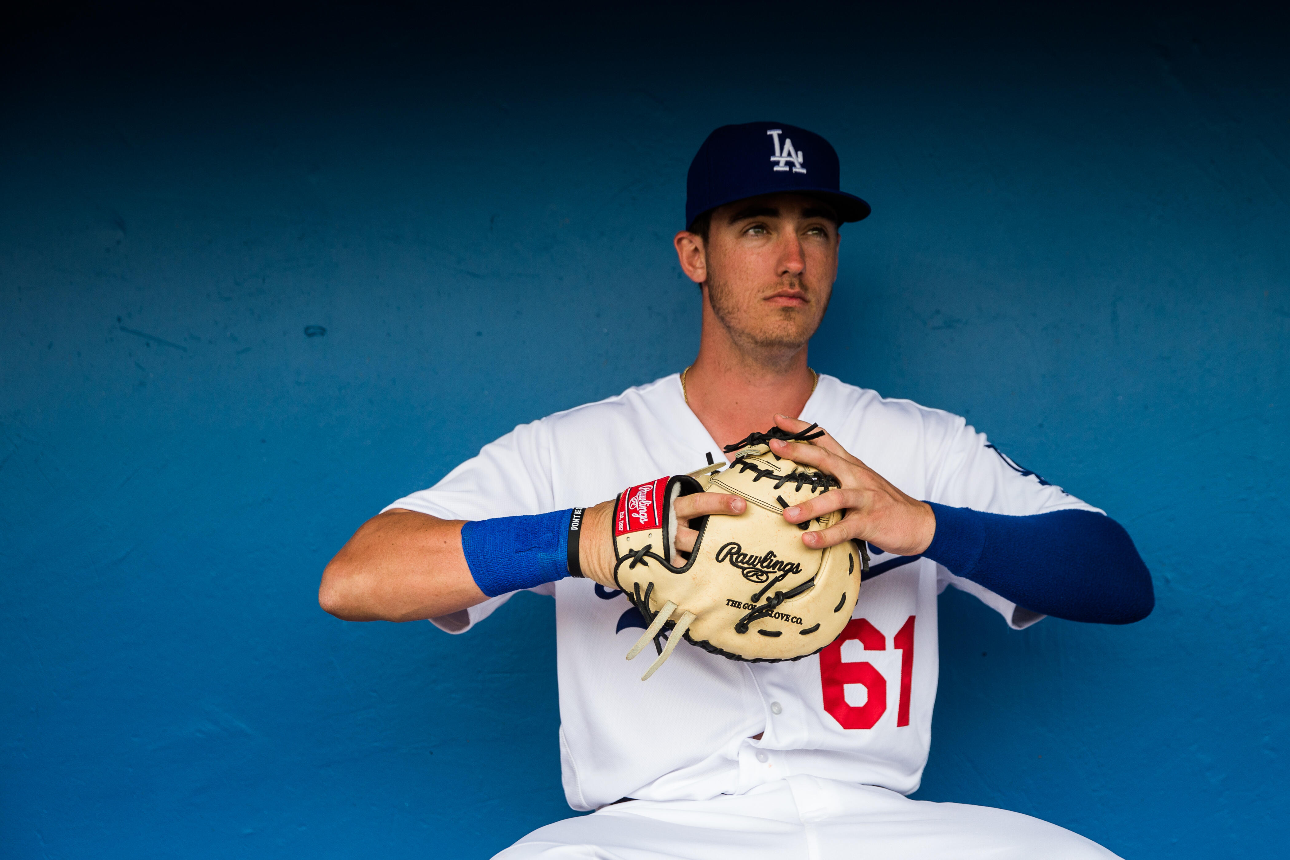 GLENDALE, AZ - FEBRUARY 27:  Cody Bellinger #61 of the Los Angeles Dodgers sits in the dugout before a spring training game against the Colorado Rockies at Camelback Ranch on February 27, 2017 in Glendale, Arizona. (Photo by Rob Tringali/Getty Images)