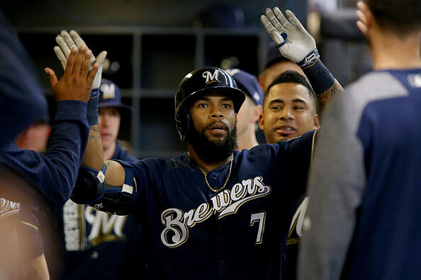 MILWAUKEE, WI - APRIL 24:  Eric Thames #7 of the Milwaukee Brewers is congratulated by teammates after hitting a home run in the first inning against the Cincinnati Reds at Miller Park on April 24, 2017 in Milwaukee, Wisconsin. (Photo by Dylan Buell/Getty Images)