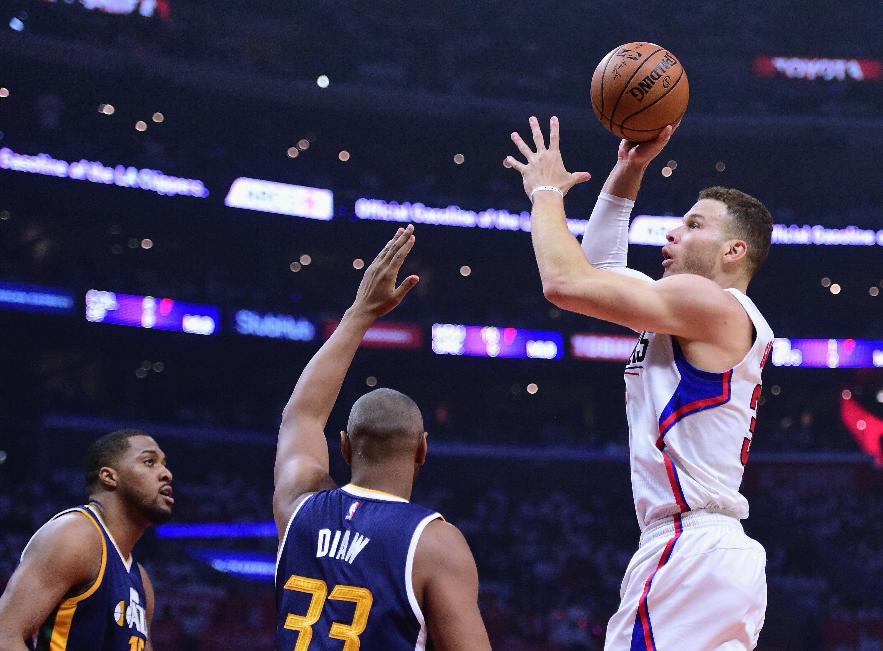 LOS ANGELES, CA - APRIL 15:  Blake Griffin #32 of the LA Clippers attempts a shot over Boris Diaw #33 and Derrick Favors #15 of the Utah Jazz during a 97-95 Jazz win during the first half at Staples Center on April 15, 2017 in Los Angeles, California.  NO