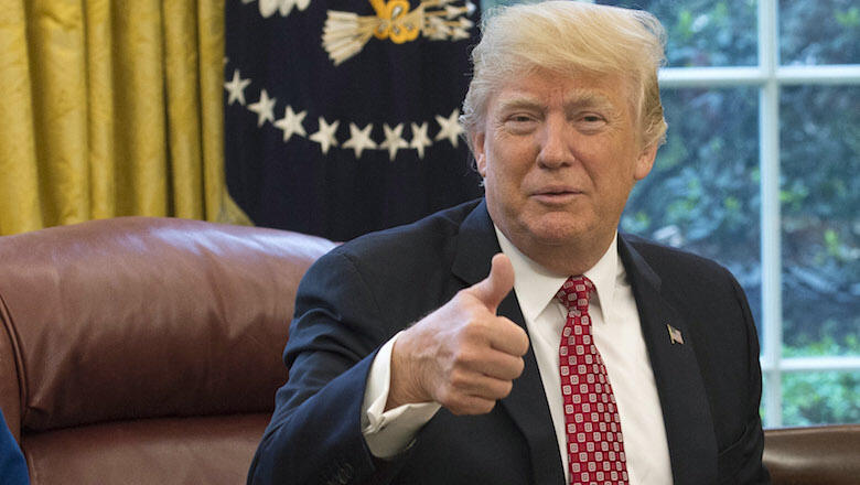 WASHINGTON, DC - APRIL 24:  (AFP OUT) U.S. President Donald Trump speaks along with his daughter Ivanka Trump (R) and NASA Astronaut Kate Rubins, during a video conference with NASA astronauts aboard the International Space Station in the Oval Office at t