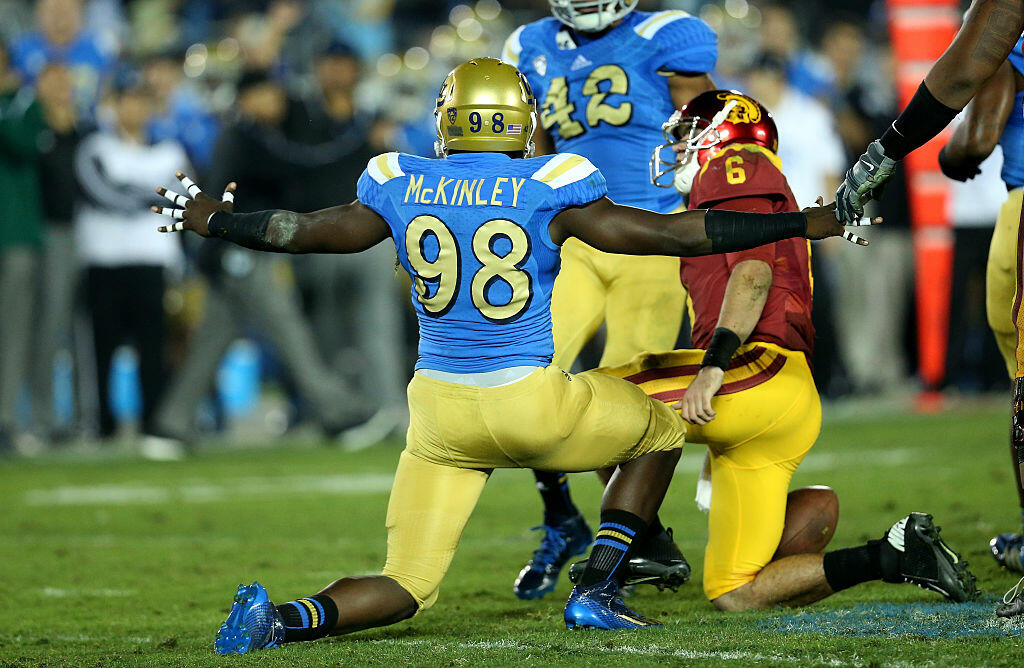 PASADENA, CA - NOVEMBER 22:  Takkarist McKinley #98 of the UCLA Bruins celebrates after sacking quarterback Cody Kessler #6 of the USC Trojans in the third quarter at the Rose Bowl on November 22, 2014 in Pasadena, California.   UCLA on 38-20.  (Photo by 