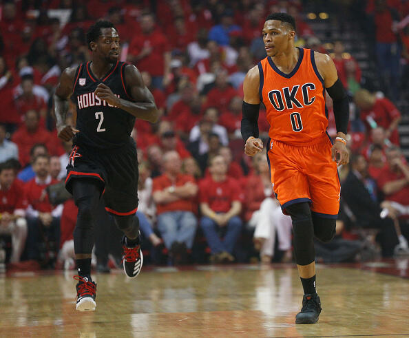 HOUSTON, TX - APRIL 16: Russell Westbrook #0 of the Oklahoma City Thunder brings the ball up the court as Patrick Beverley #2 of the Houston Rockets follows during Game One of the first round of the Western Conference 2017 NBA Playoffs at Toyota Center on April 16, 2017 in Houston, Texas. NOTE TO USER: User expressly acknowledges and agrees that, by downloading and/or using this photograph, user is consenting to the terms and conditions of the Getty Images License Agreement.  (Photo by Bob Levey/Getty Images)