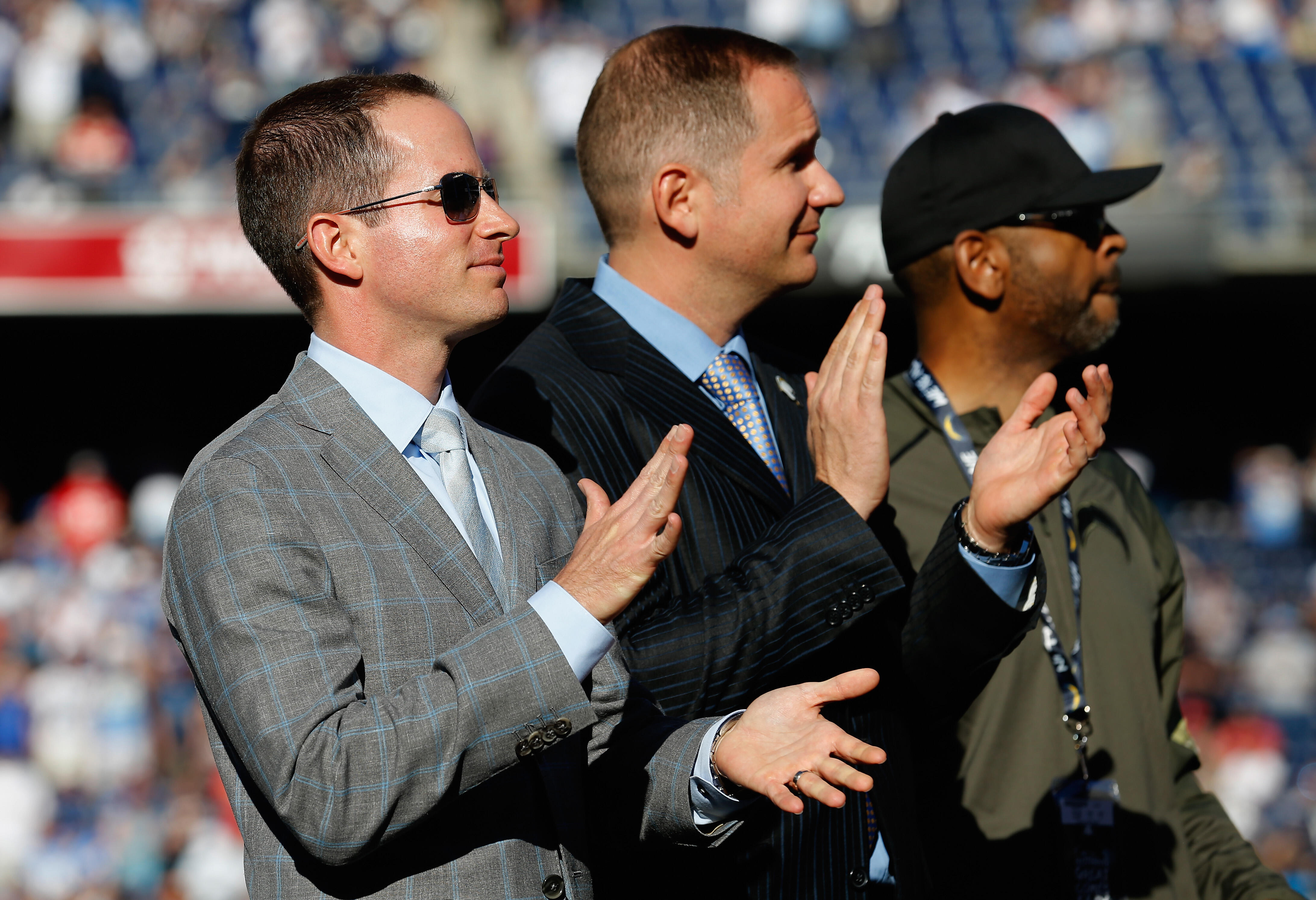 SAN DIEGO, CA - NOVEMBER 22: John Spanos  (grey suit) President of Football Operations for the San Diego Chargers looks on with A.G. Spanos President of Business Operations for the San Diego Chargers during halftime of a game against the Kansas City Chief