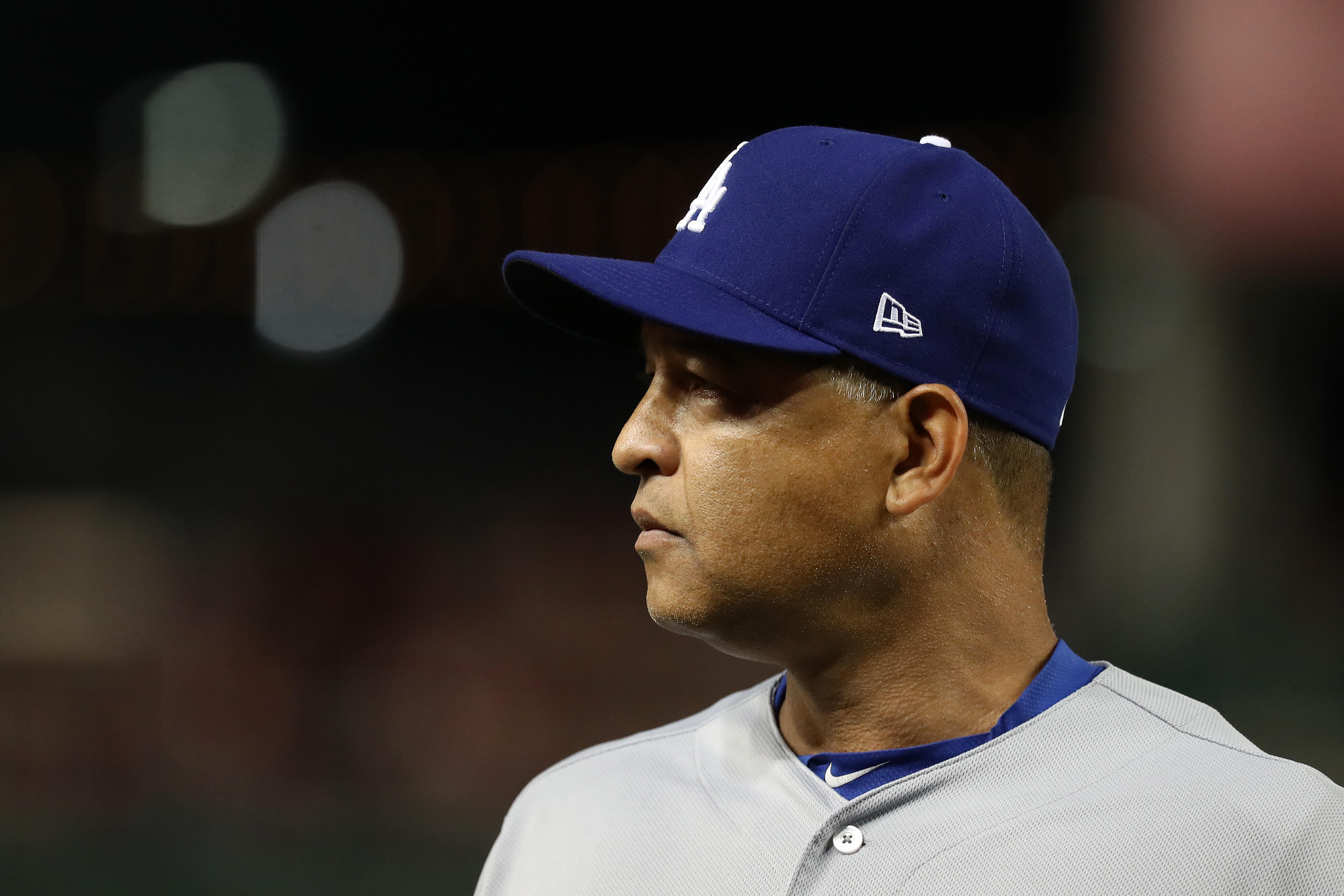 WASHINGTON, DC - OCTOBER 7: Manager Dave Roberts #30 of the Los Angeles Dodgers walks off of the field in the seventh inning against the Washington Nationals in game one of the National League Division Series at Nationals Park on October 7, 2016 in Washin