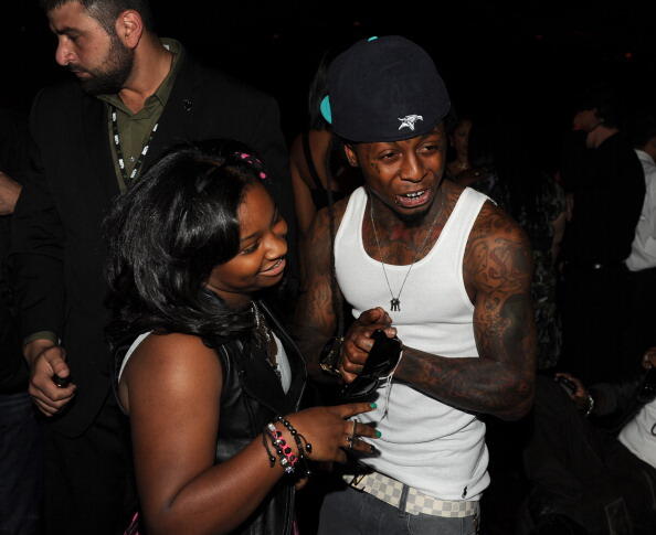 LOS ANGELES, CA - JUNE 26:  Reginae Carter  (L) and rapper Lil Wayne in the audience during the BET Awards '11 held at the Shrine Auditorium on June 26, 2011 in Los Angeles, California.  (Photo by Kevin Winter/Getty Images)