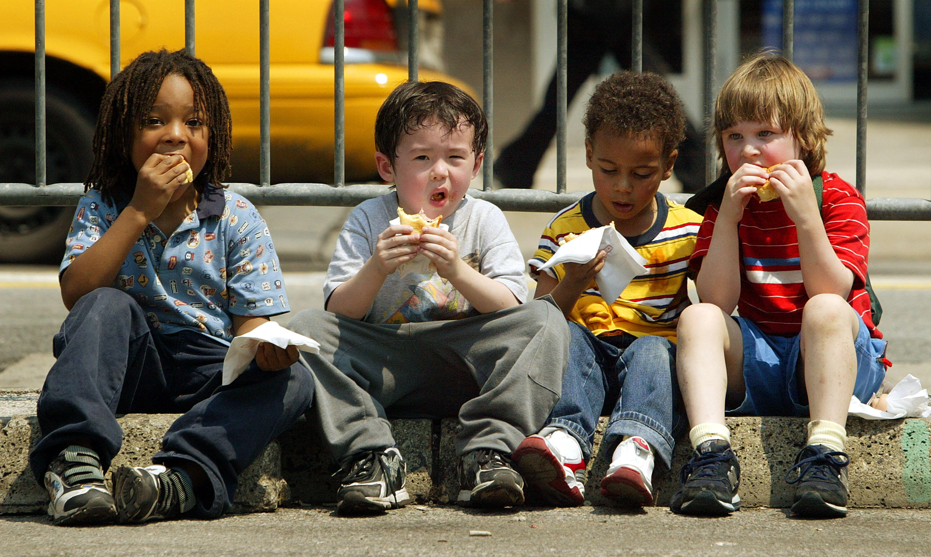 NEW YORK - MAY 11:  Children eat free Oscar Meyer Wiener hot dogs in Union Square at a kickoff event announcing the Oscar Meyer 