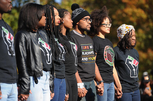 COLUMBIA, MO - NOVEMBER 9: Jonathan Butler (c), a University of Missouri grad student who did a 7 day hunger strike listens during a forum speaking to students on the campus of University of Missouri - Columbia on November 9, 2015 in Columbia, Missouri. Students celebrate the resignation of University of Missouri System President Tim Wolfe amid allegations of racism. (Photo by Michael B. Thomas/Getty Images)