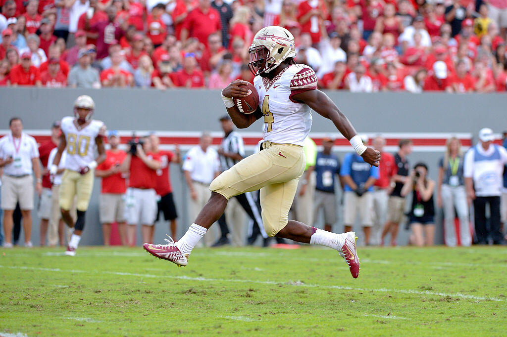 RALEIGH, NC - SEPTEMBER 27: Dalvin Cook #4 of the Florida State Seminoles runs untouch into the end zone for a touchdown during their game against the North Carolina State Wolfpack at Carter-Finley Stadium on September 27, 2014 in Raleigh, North Carolina.