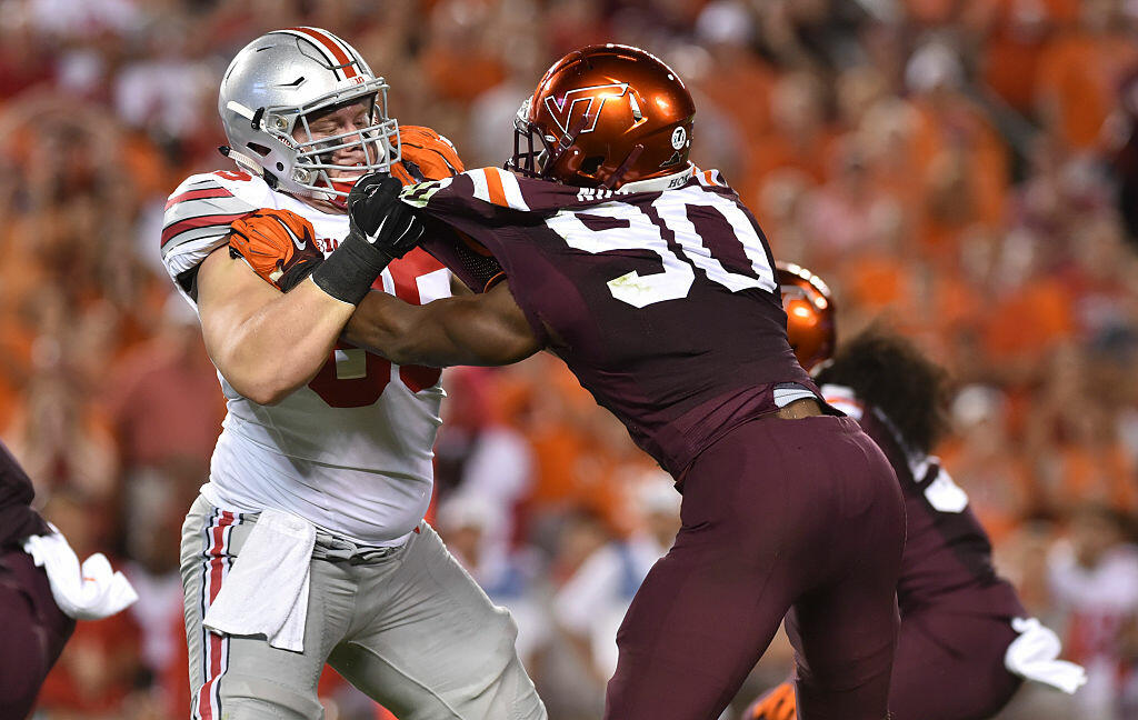 BLACKSBURG, VA - SEPTEMBER 7: Offensive lineman Pat Elflein #65 of the Ohio State Buckeyes blocks defensive end Dadi Nicolas #90 of the Virginia Tech Hokies in the first half at Lane Stadium on September 7, 2015 in Blacksburg, Virginia. (Photo by Michael Shroyer/Getty Images)