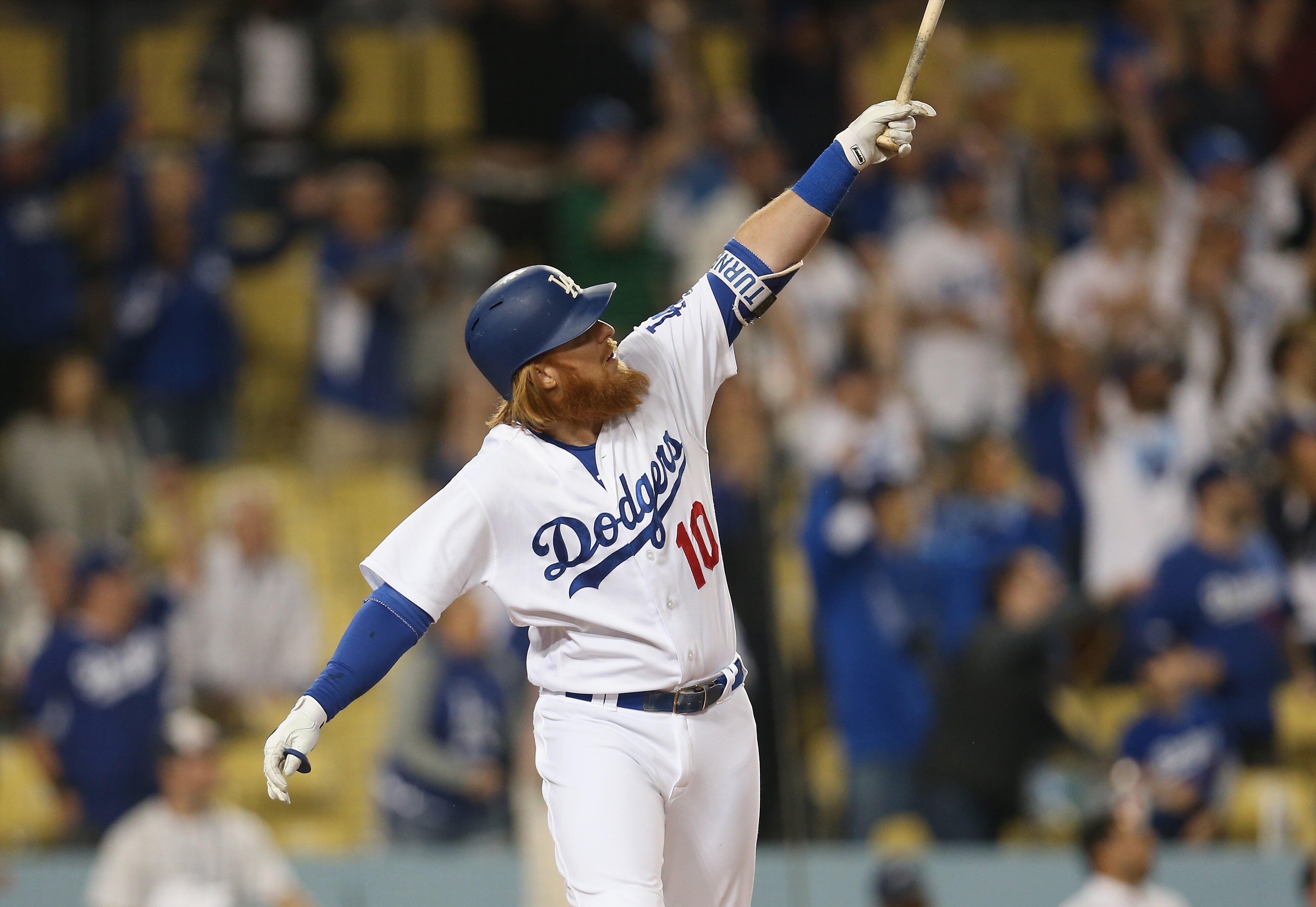 LOS ANGELES, CA - APRIL 29:  Pinch hitter Justin Turner #10 of the Los Angeles Dodgers watches his solo home run in the ninth inning against the Philadelphia Phillies at Dodger Stadium on April 29, 2017 in Los Angeles, California.  It was the third of thr