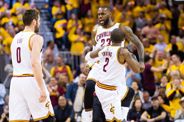 CLEVELAND, OH - MAY 1: LeBron James #23 celebrates with Kyrie Irving #2 and Kevin Love #0 of the Cleveland Cavaliers after scoring during the first half of the NBA Eastern Conference semifinals against the Toronto Raptors at Quicken Loans Arena on May 1, 2017 in Cleveland, Ohio. NOTE TO USER: User expressly acknowledges and agrees that, by downloading and or using this photograph, User is consenting to the terms and conditions of the Getty Images License Agreement. (Photo by Jason Miller/Getty Images)